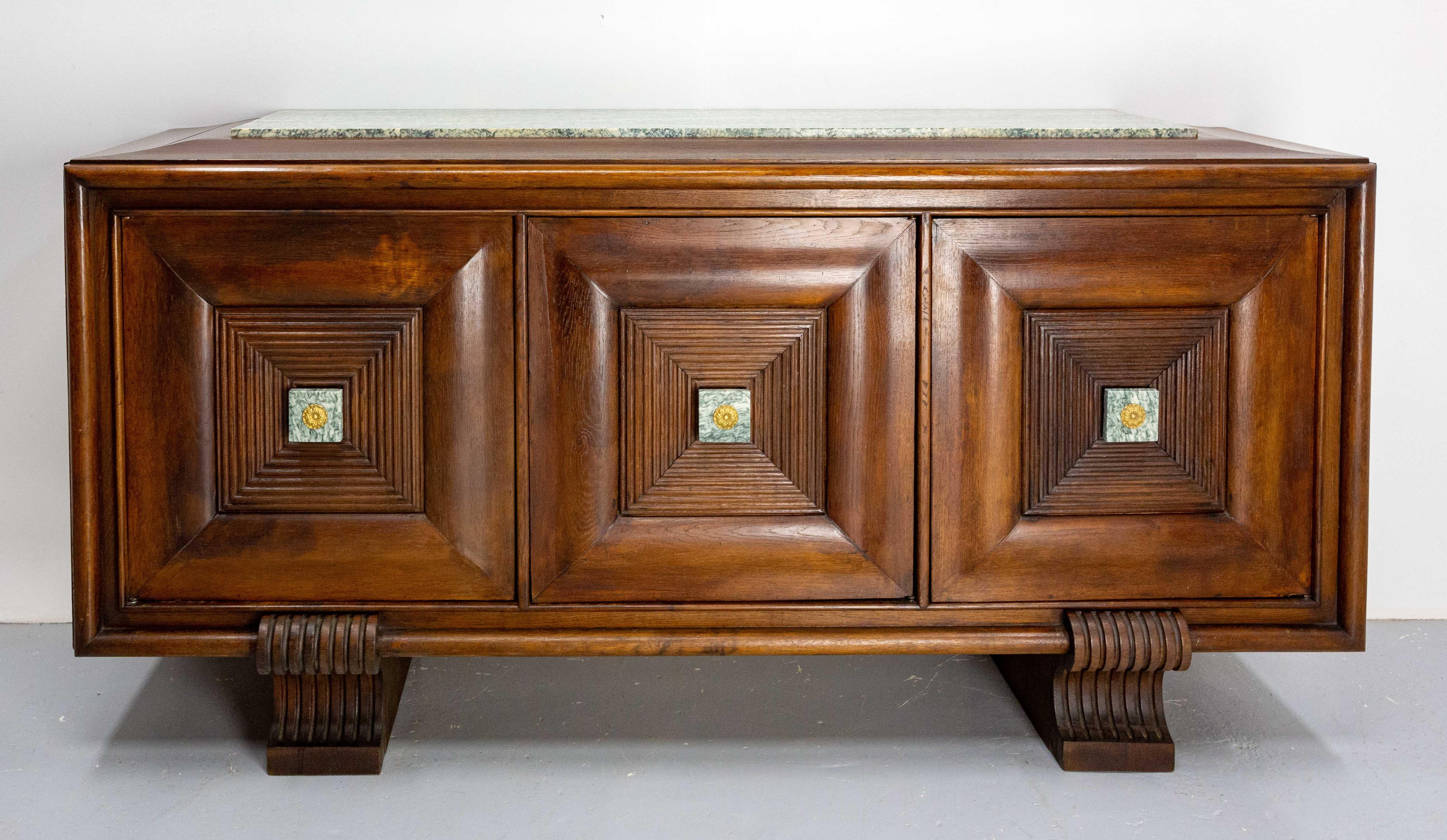 French buffet oak, marble top. 
Three doors with door handles of marble and brass.
The marble top has been glued ( please look photo: the repair is very difficult to see) and one foot and been restored by our cabinet maker (see photo)
Good