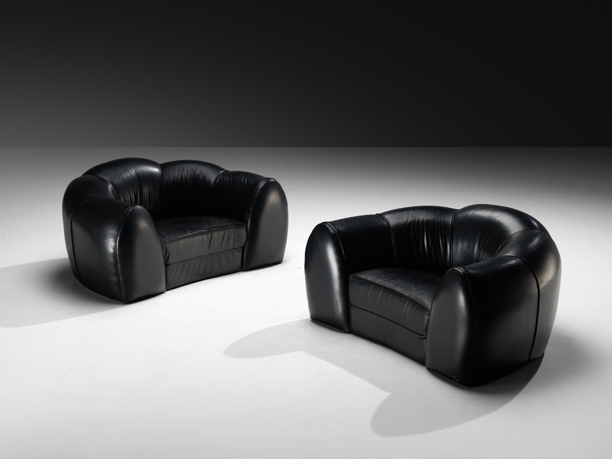 Lounge chairs or loveseats, leather, France, 1970s

These remarkable leather lounge chairs, designed and crafted in France during the 1970s, are a true representation of the era’s innovative and artistic approach to furniture design. The bold,