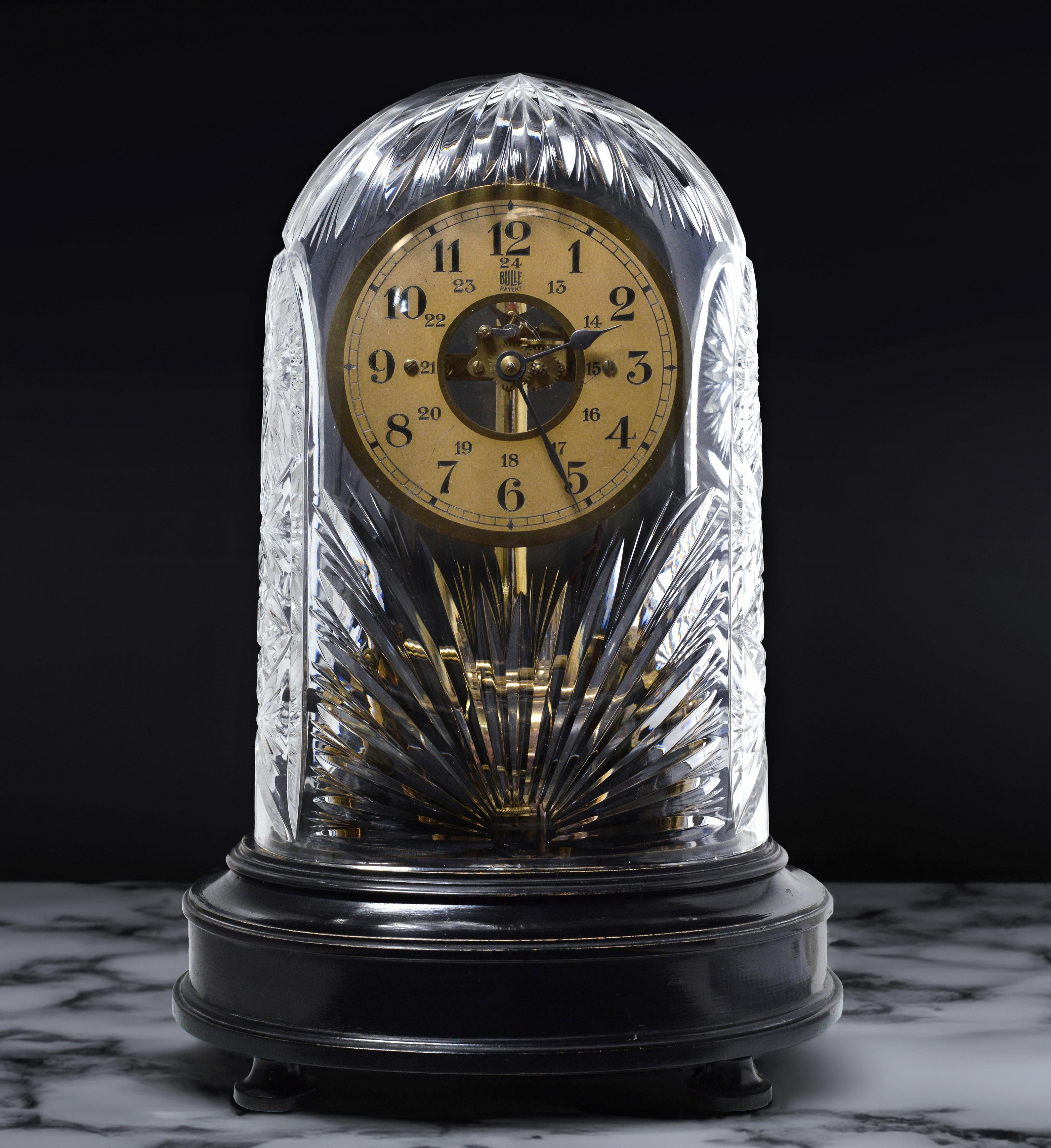 Legendary creation of French inventors and Swedish glass works cooperation from Art Deco epoque (circa 1930s). Brass electromagnetic movement. Dial with Arabic numerals. On plinth of blackened wood. Hand cut crystal glass dome (awesome and rare