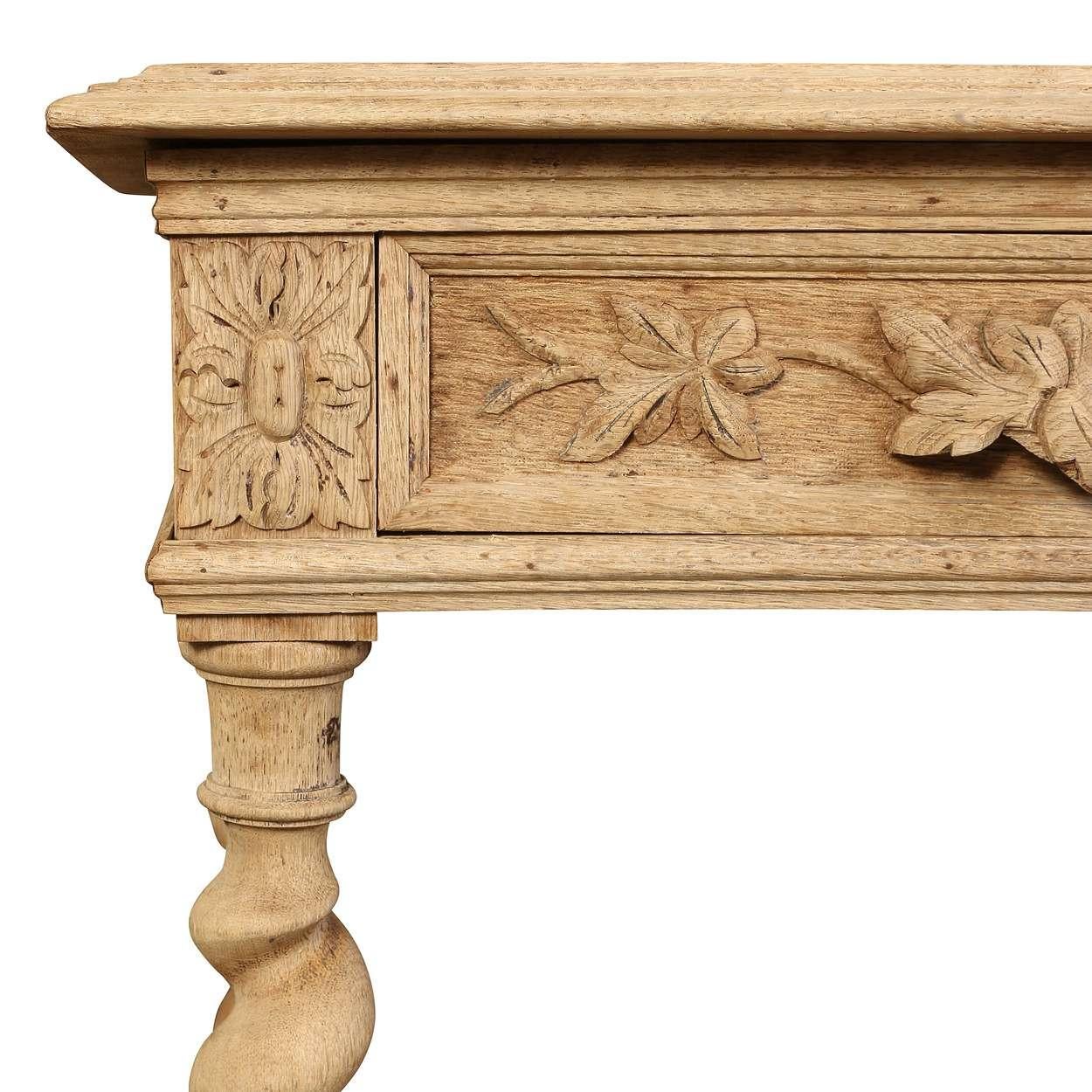 A French Bureau Plat Desk in bleached oak, set on elegant barley twist legs, offering a blend of classic style and functional workspace.