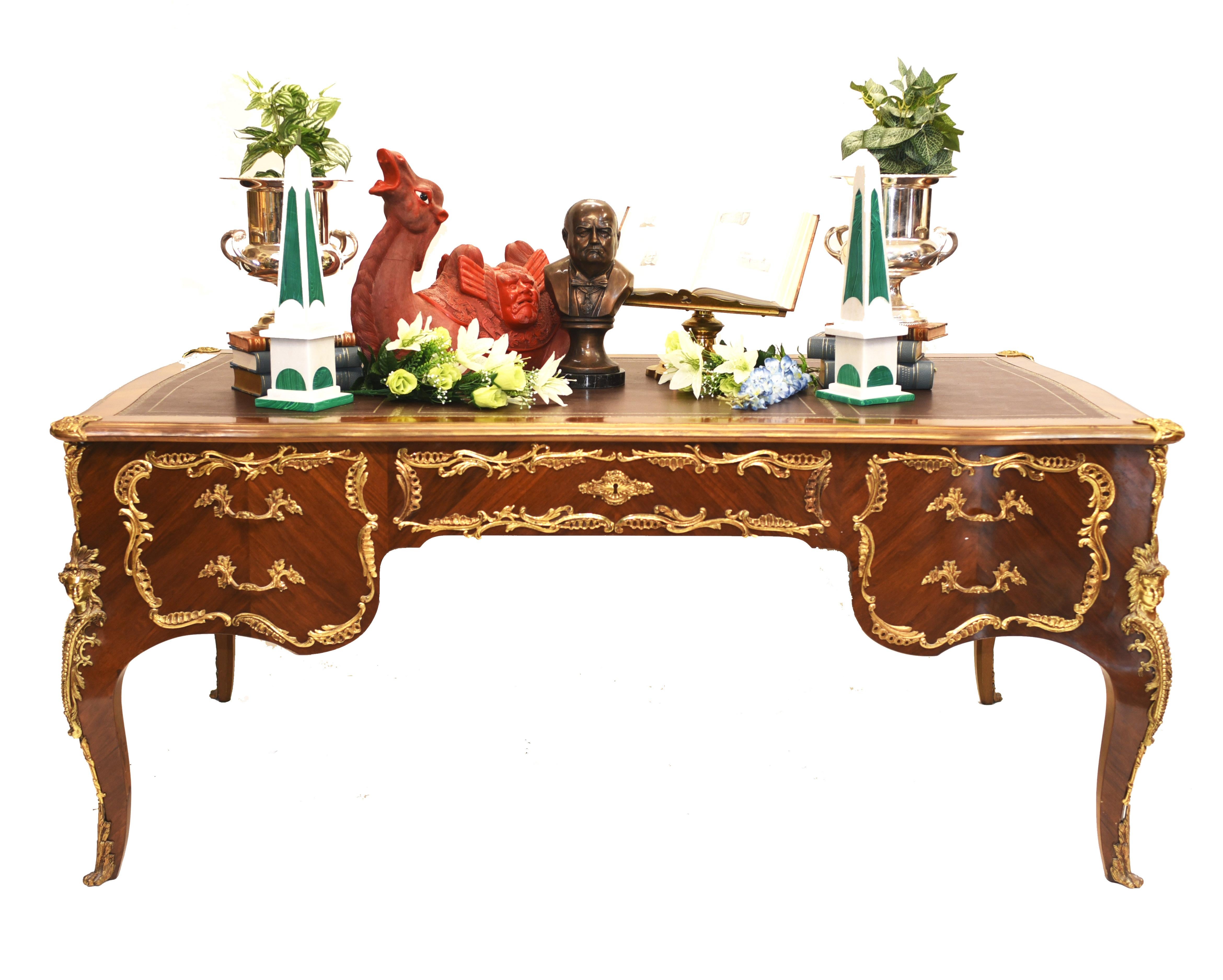 Gorgeous French Empire bureau plat 
Classic French antique desk in kingwood with ormolu fixtures
We date this desk to circa 1930
Has drawers on both sides although one side they are decorative so this is a dummy partners desk
Great for a home