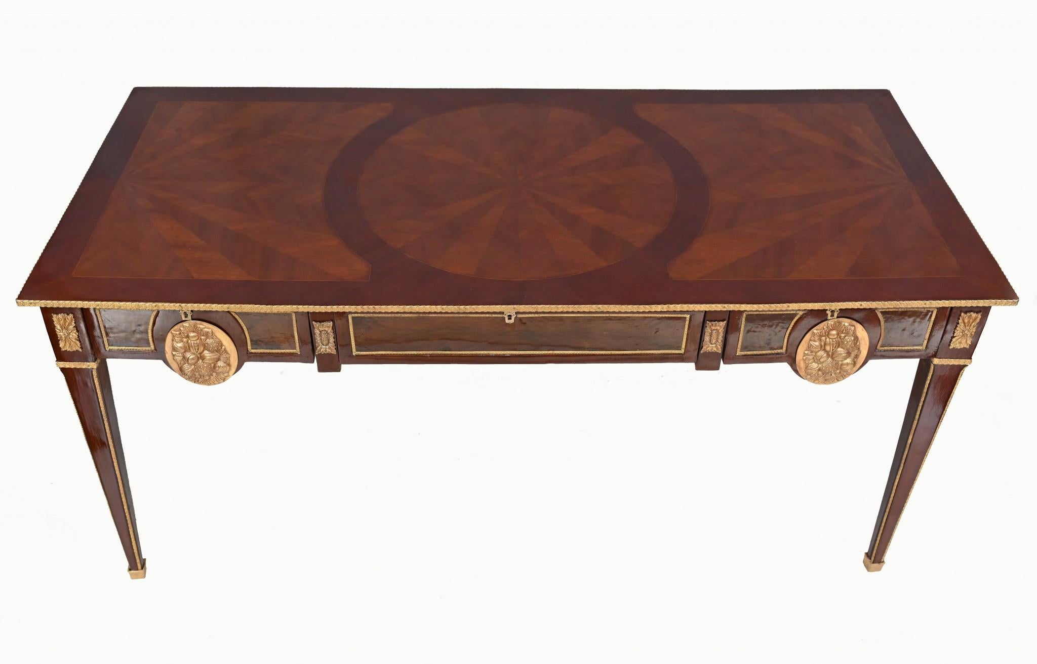 You are viewing a gorgeous French Empire style bureau plat desk
Good size to this clean and minimal desk which has been hand crafted from kingwood
Ormolu fixtures are original including the two plaques on the drawers
Elegantly tapered legs and some