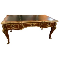 French Bureau Plat or Desk, Mahogany with Black Leather Top by J Sargues French Bureau Plat or Desk, Mahogany with Black Leather Top by J Sargues