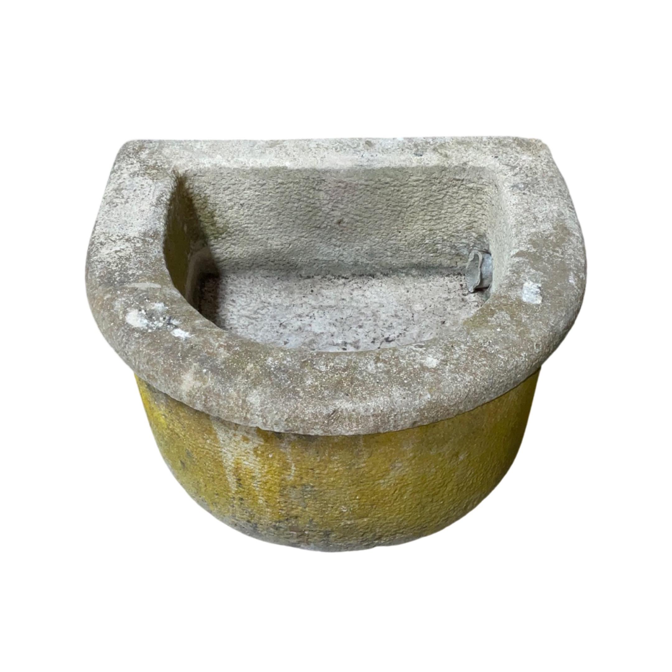 Round-edged sink. Made out of Burgundy stone. Originates from France.