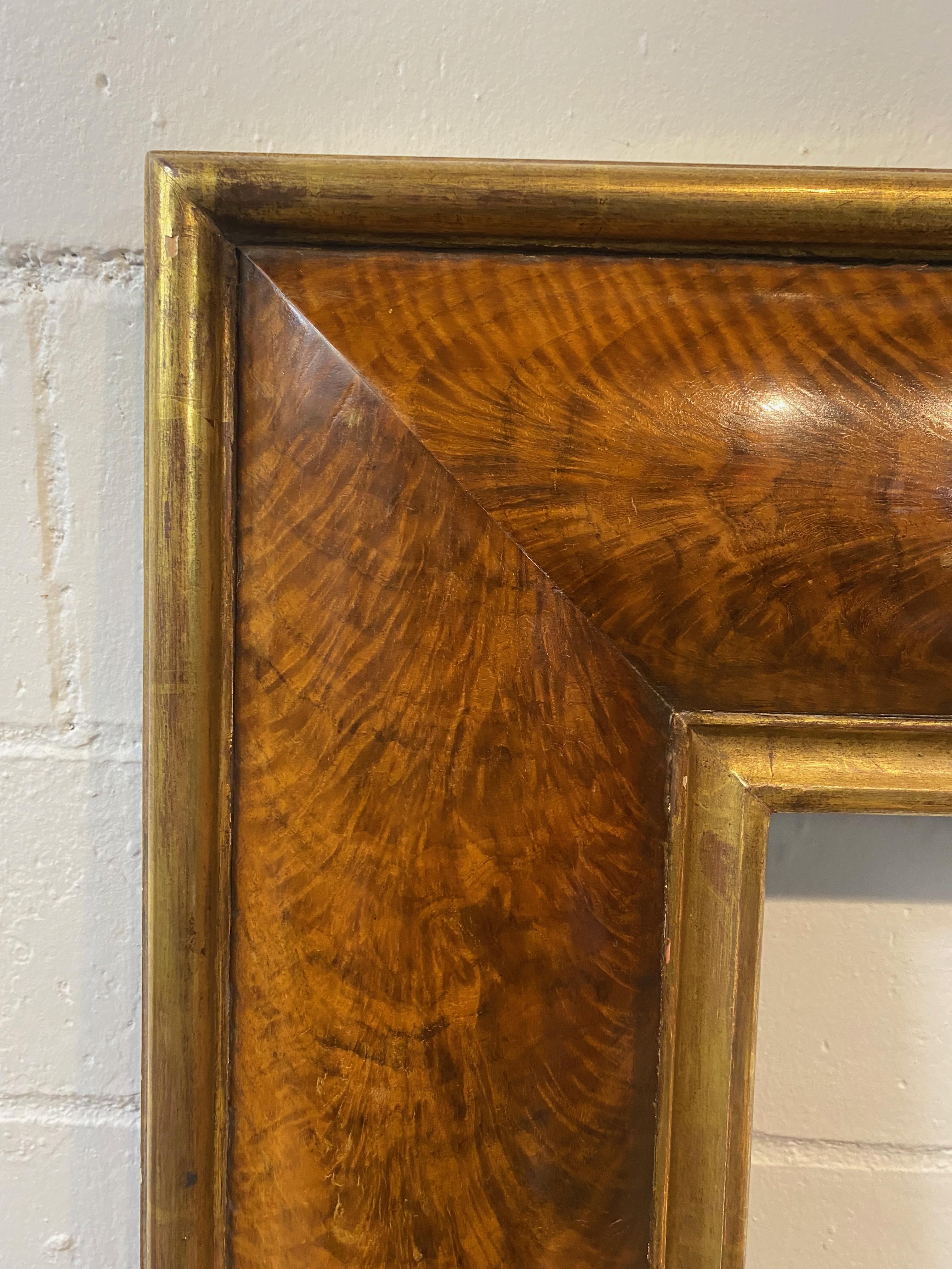 This is a stunning French burl walnut frame with gilt trim, an exquisite piece of art that showcases the best of contemporary French craftsmanship. The beautiful convex shape of the frame accentuates the gorgeous burl walnut wood grain, creating a