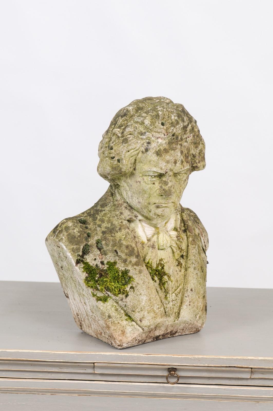 A French weathered cement bust of Ludwig van Beethoven with moss from the early 20th century. We found this 1900s cement bust on one of our trips to France, and it was love at first sight! Splashes of moss bring an earthy edge to Beethoven's serious