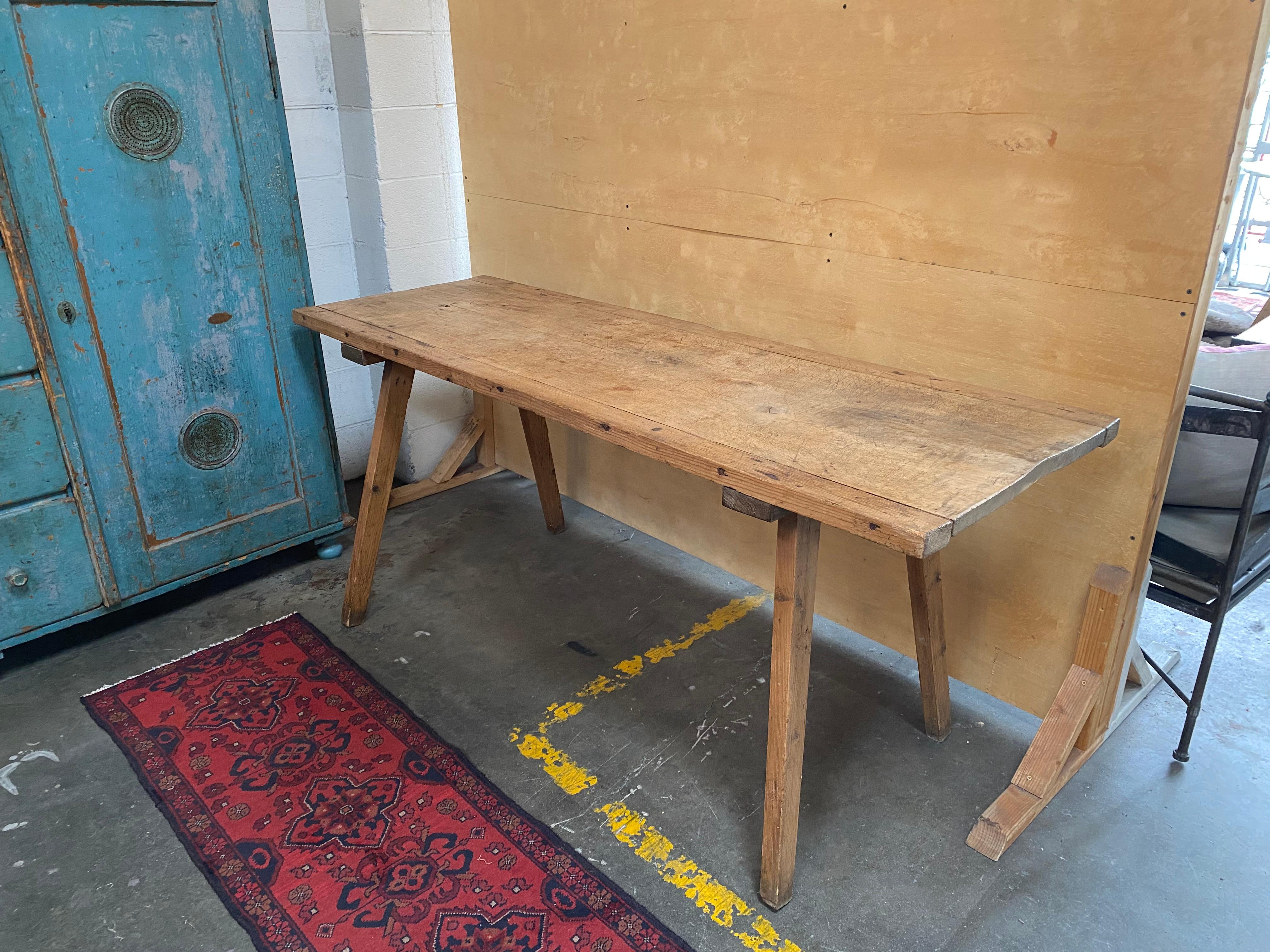 This beautifully crafted French butcher block console table is in great condition with sturdy legs and a beautiful antique finish. With a 24' depth, it would make a fantastic addition with flexible use to a multitude of rooms as either a console or