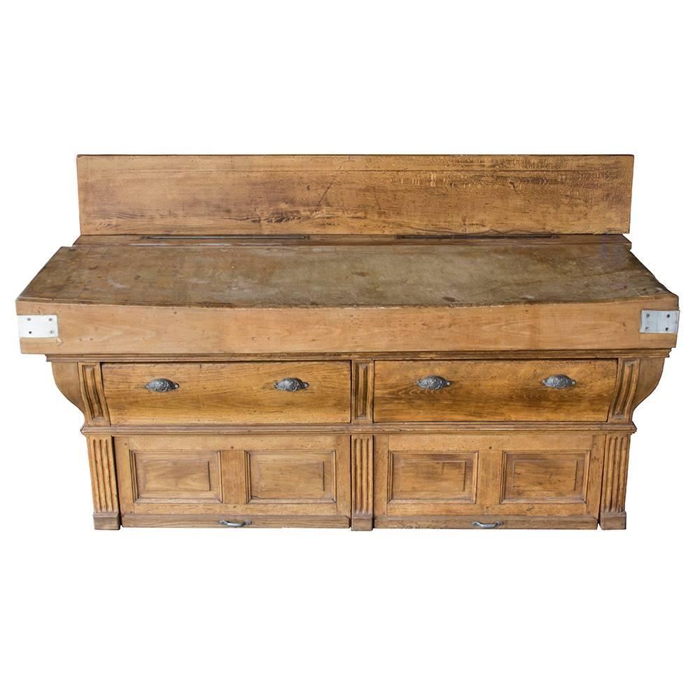 This absolutely gorgeous butcher block will be the focal point of any room. Made in France in the late 19th century, this particular style has a lower cabinet the goes all the way to the floor. Swoop fronted drawers are finished with beautifully