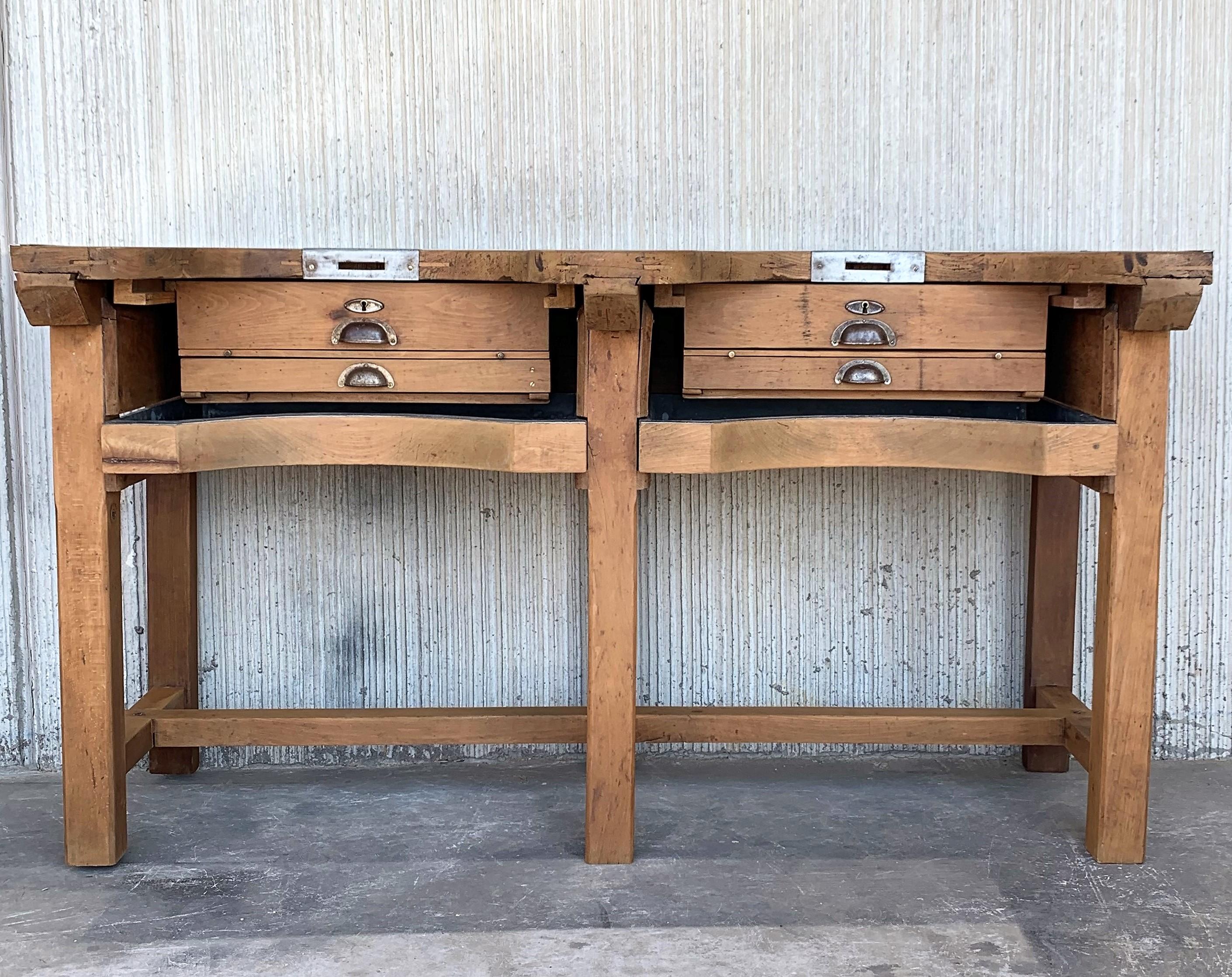 Wonderful pine jewery bench table or butcher block from France with two large zinc-lined drawer. 
A rustic vintage workbench in pine complete with drawers and clamps, French, 1950. Beautifully marks from decades of use, with dents and gouges; large