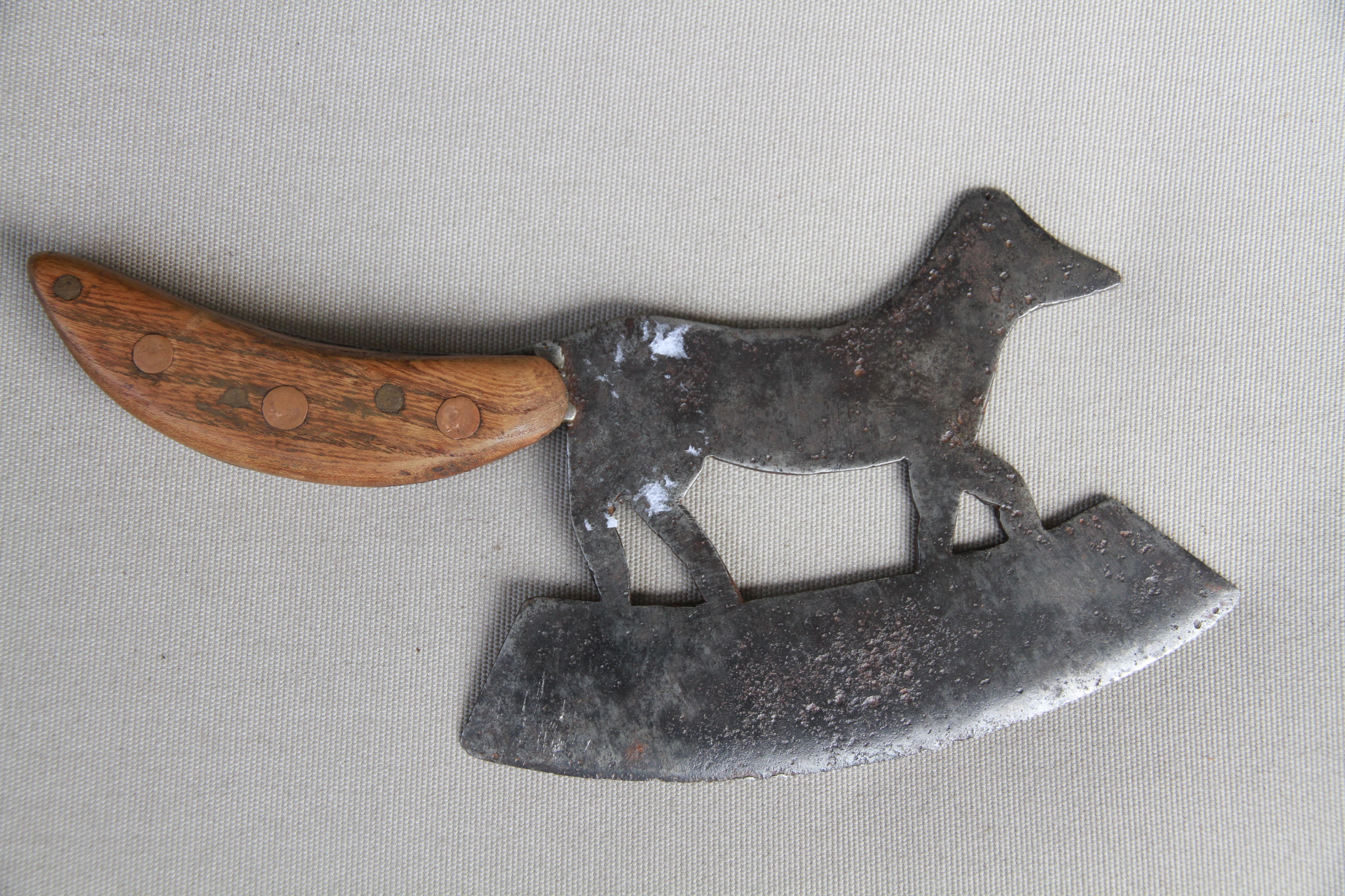 A delightful figurative butcher's cleaver from France in the shape of a fox. With a 7.25 inch blade, the integral handle has wooden scales attached with copper rivets.