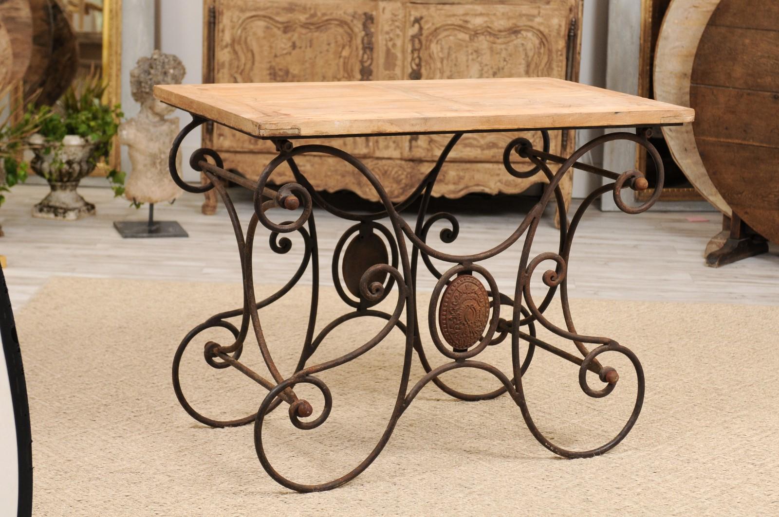 A French butcher's table with scrolled iron base, medallions and rectangular wooden top from the late 19th century. We love a gorgeous butcher’s table, and this one certainly doesn’t disappoint! We were first drawn to the sturdy and stately wood