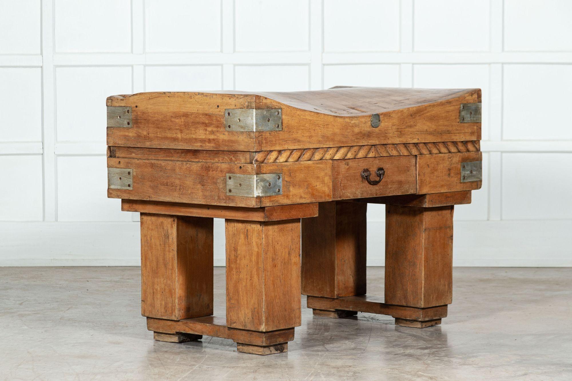 French butchers block on original stand. Beech, brown, early 20th century, circa 1930.
Great even color, size, wear and detailing. Typical French rope style carved detailing dividing the base and top. Could be used as a kitchen Island or
