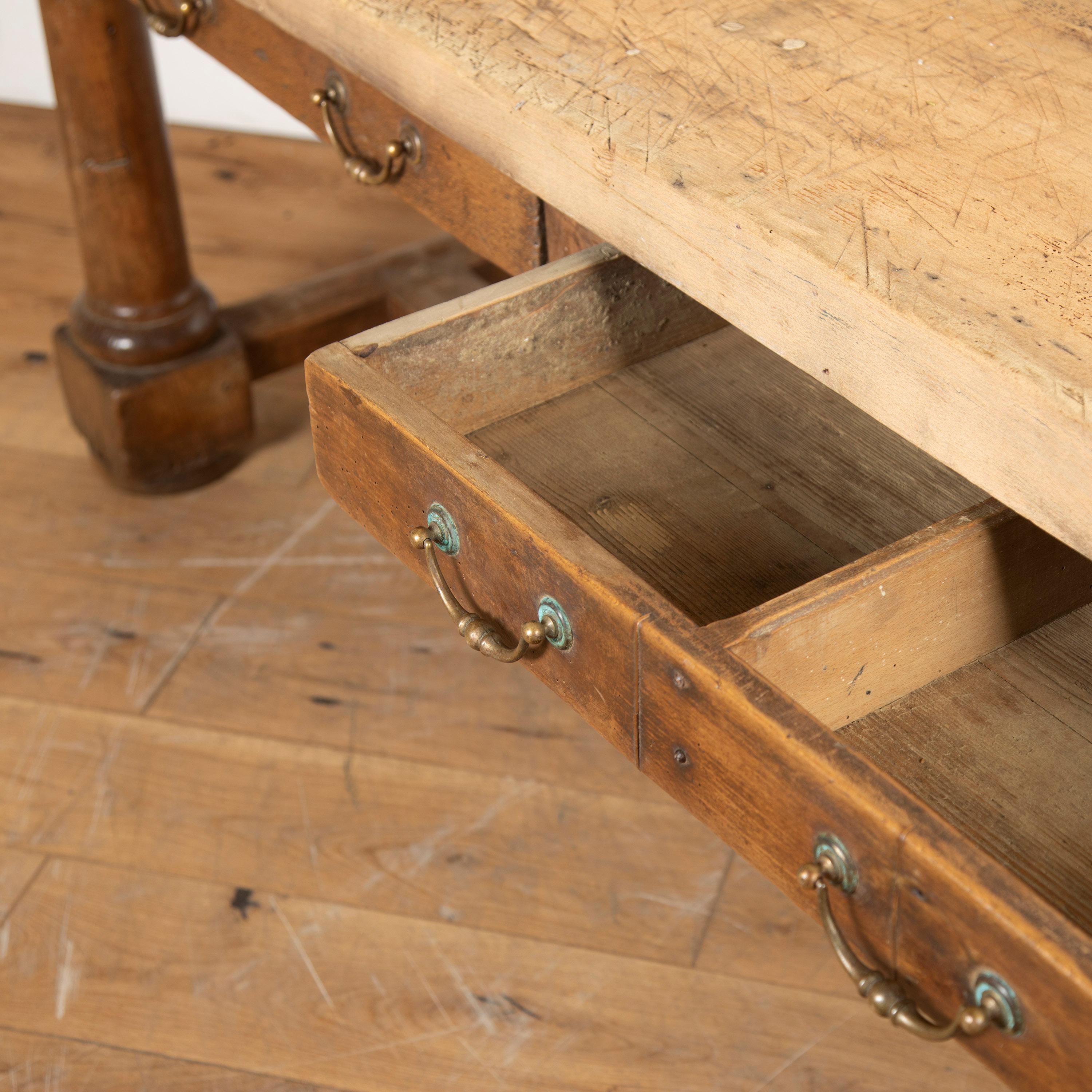 Fantastic French early 19th century butcher's table.

This table features a lovely walnut base and drawers that would make for useful storage within a kitchen or being used as a central island. 

It has attractive signs of wear to both the base