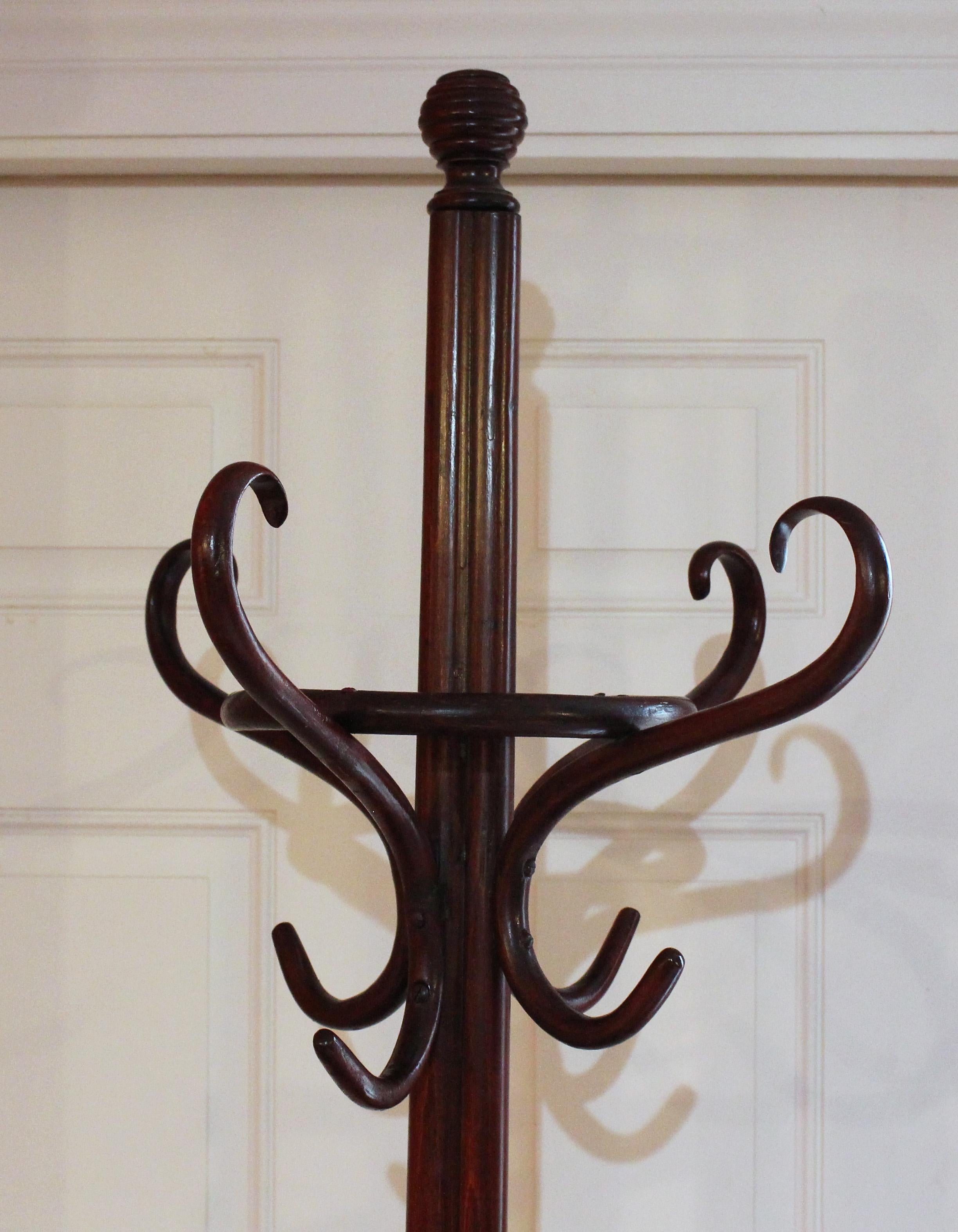 Circa 1900 bentwood hall tree, Art Nouveau, French. Central cluster column with beehive turned finial. Four 