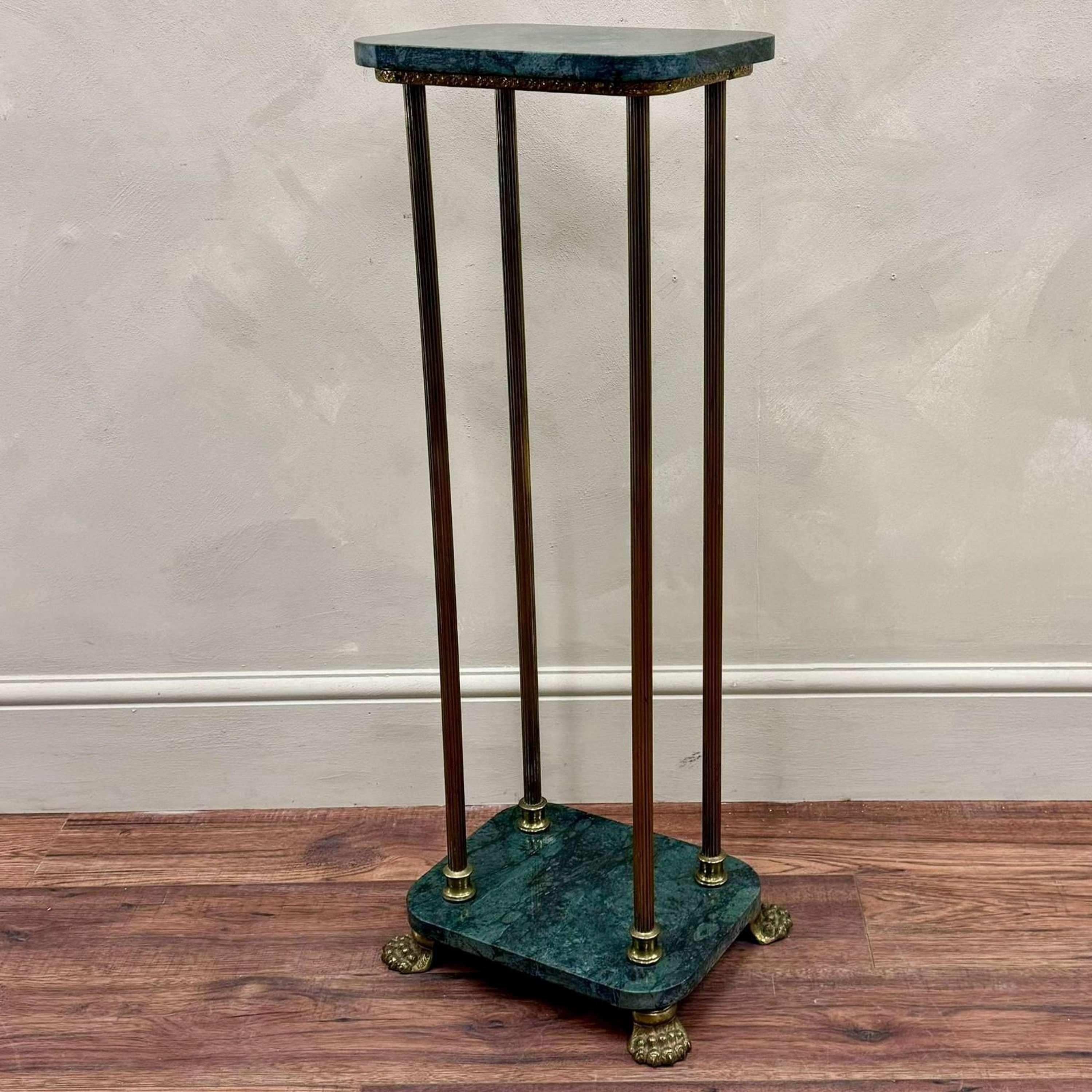 Marble and brass pedestal / plant stand 
Brass reeded columns joining a marble base with lion paw brass feet. 
France, circa 1930. 

Height - 90 cm
Top W 32 cm x D 24.5 cm
Feet Width - 35 cm
Feet Depth - 28 cm

Please message if any further info or