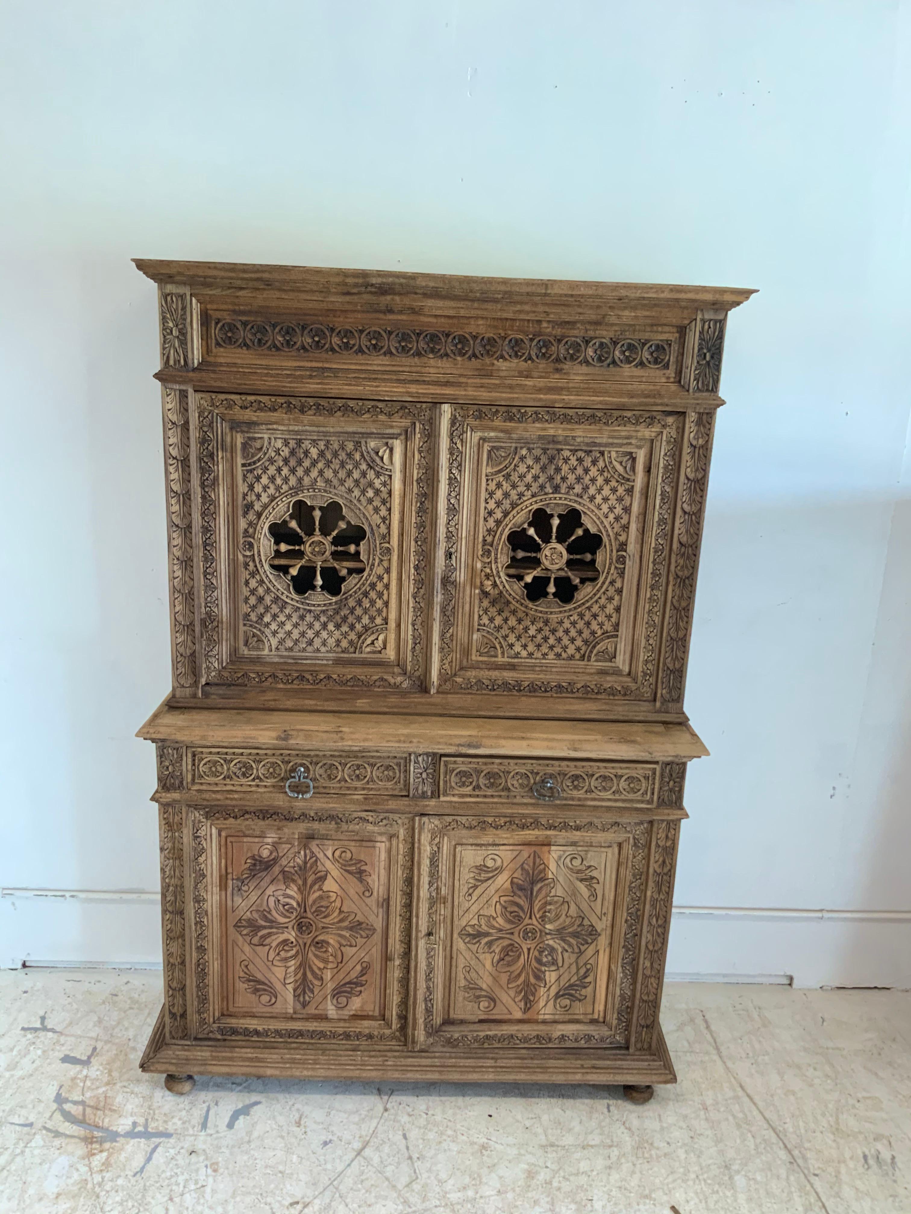 French antique cabinet deux-corps Normandy Henry II style bleached and in walnut wood with 2 doors in the top and 2 doors plus 2 drawers with dove tails on the bottom from late 19th century.