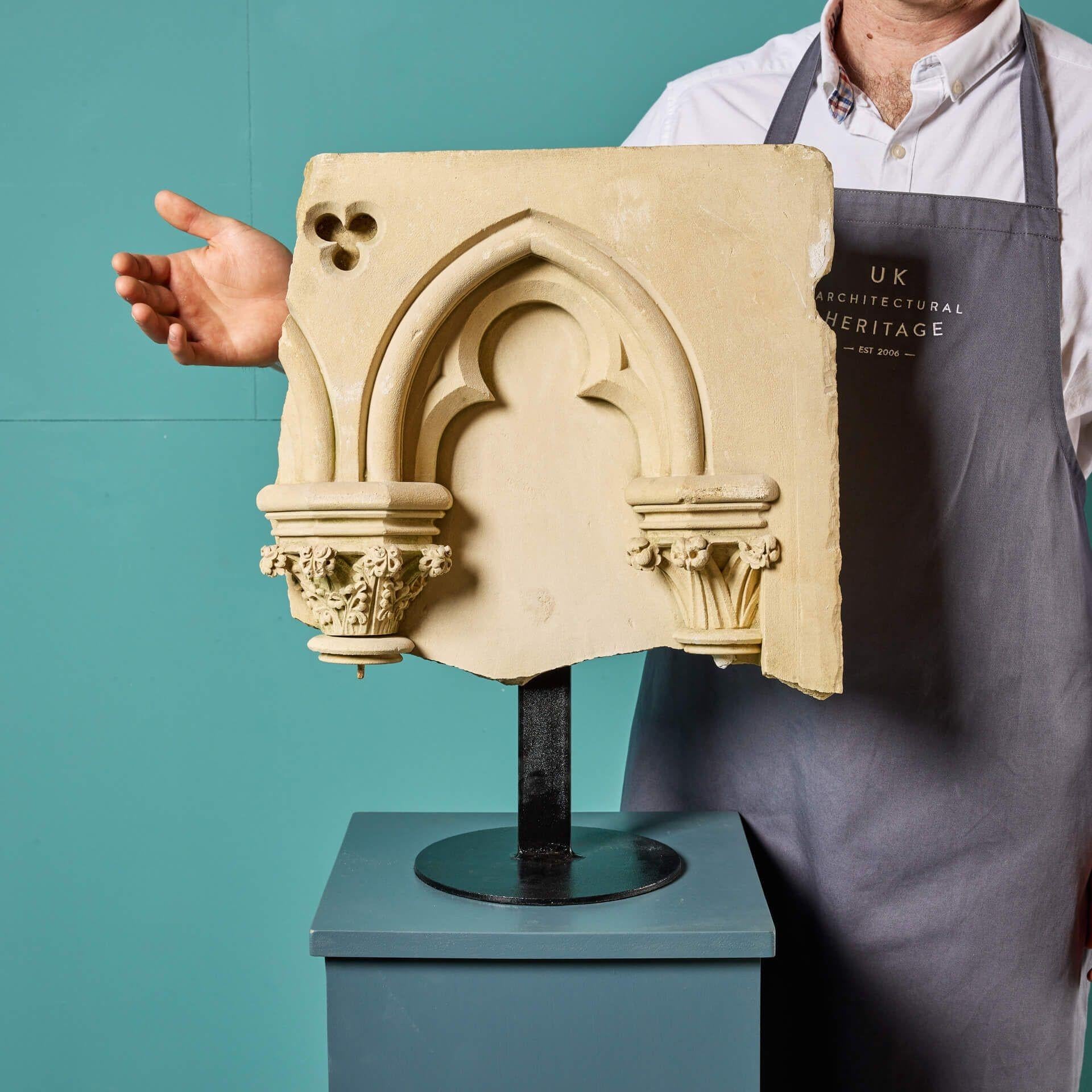 An excellent mid 19th century French Caen stone architectural fragment on stand reputedly from a church destroyed in WWII. With its beautiful cream tone and crisp quality, this carved limestone fragment is reminiscent of blind arcades found in