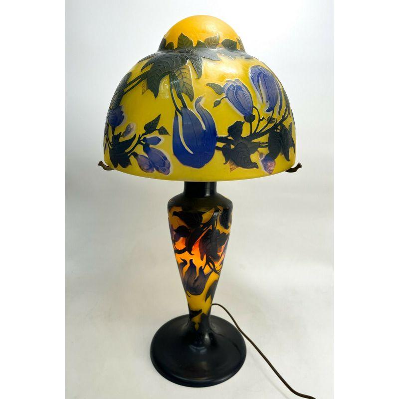French Cameo 3 layer Galle Style table lamp, early 20th century.

3 layer blue, green, and yellow to the glass with acid etched florals and vines throughout. Unmarked to the glass. Marked 