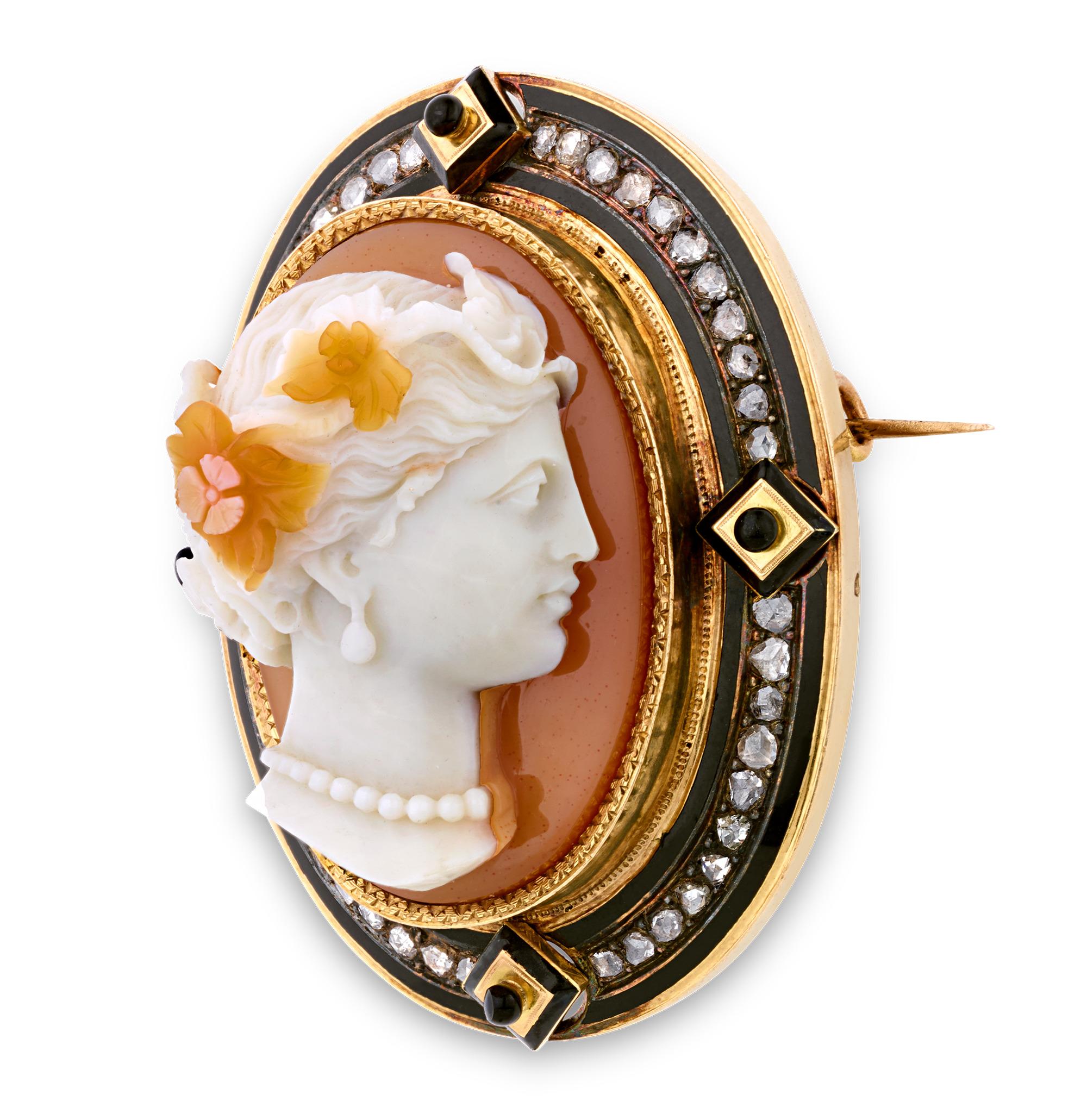 Exuding the elegance of the Victorian era, this exquisitely carved French agate cameo features a neoclassical maiden in profile, adorned with a delicate floral crown. Her serene expression is framed by intricate curls, while a pearl necklace and