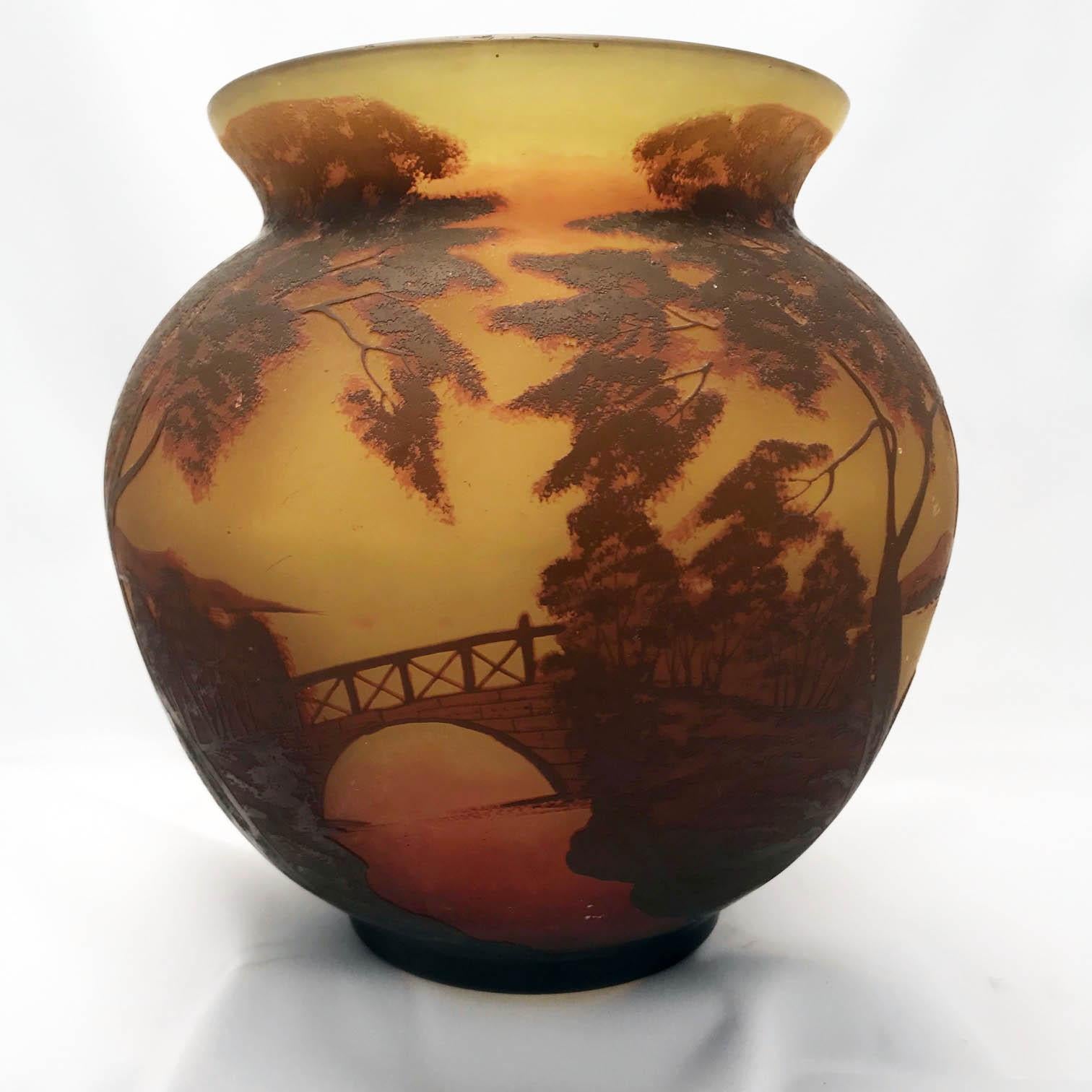 This vase by Arsall is very evocative of the Art Nouveau period in France and stands up well to comparison with Galle or Daum at a fraction of the cost. It is Cameo etched with an extensive Romantic landscape on a shaded peach and yellow ground.