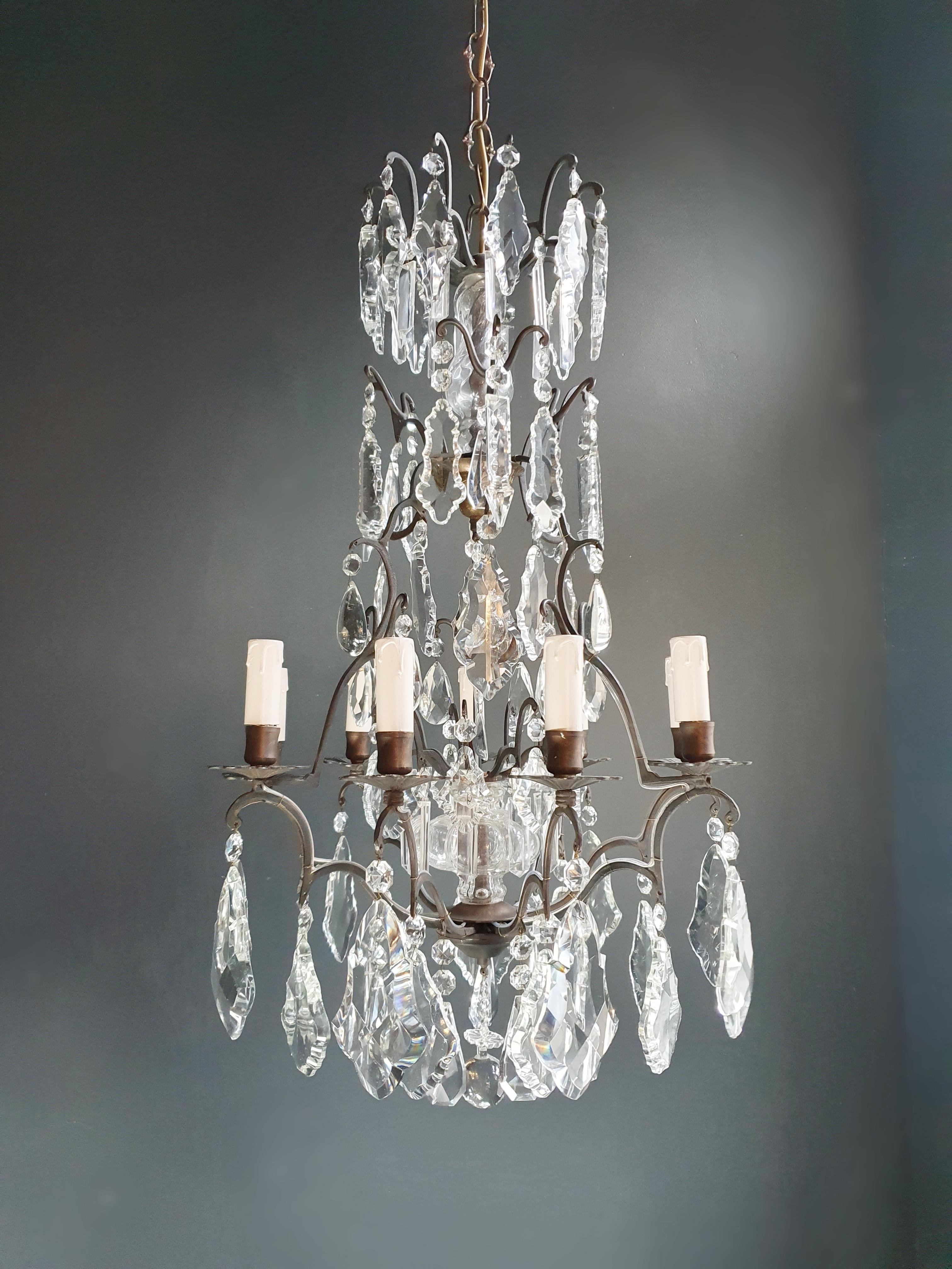 **Restored Vintage Chandelier - Preserving History with Care in Berlin**

This vintage chandelier has been thoughtfully restored in Berlin, capturing the essence of its historical charm. Its electrical wiring has been expertly adapted for use in the