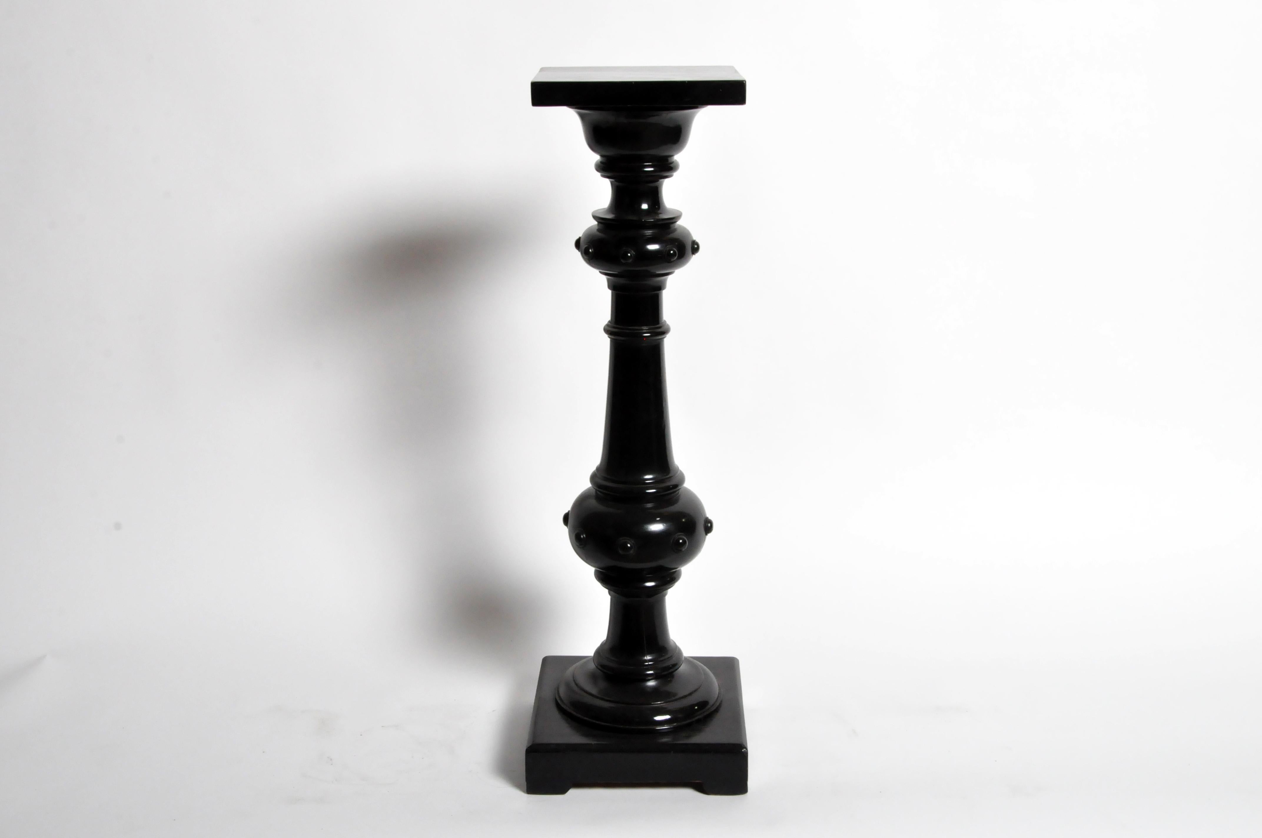 This solid hardwood stand was turned on a lathe and covered in black lacquer paint. It may have been a sculpture stand as there are no obvious burn marks or stains. Probably from the 19th century. Wear consistent with age and use.
 