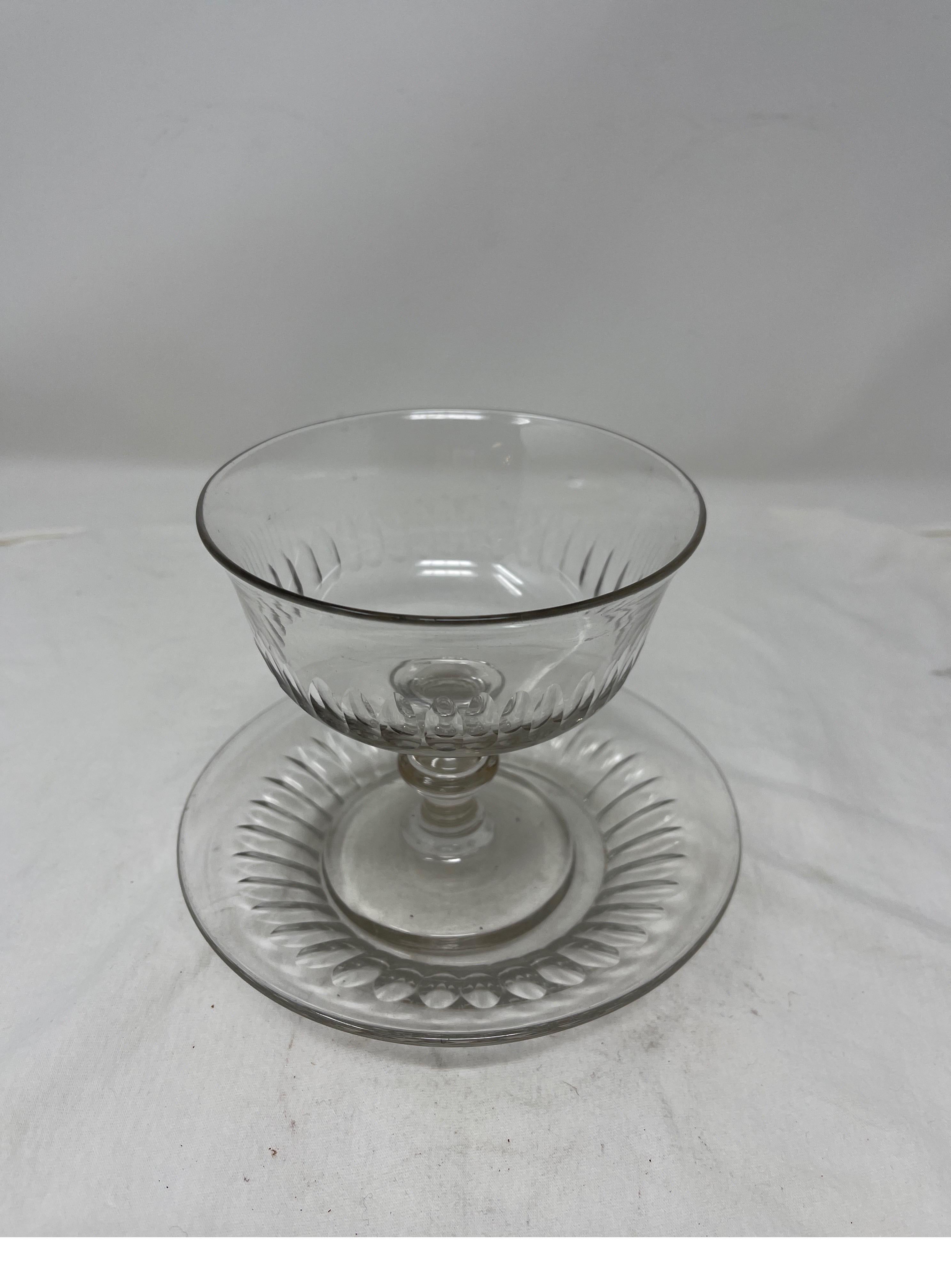 French pedestal glass candy dish with accompanying plate. This delicate piece with a striking vertical cut glass pattern can house your finest chocolates and dress any kitchen counter or entry table. 

Measures: Plate is 6 1/2” D
5