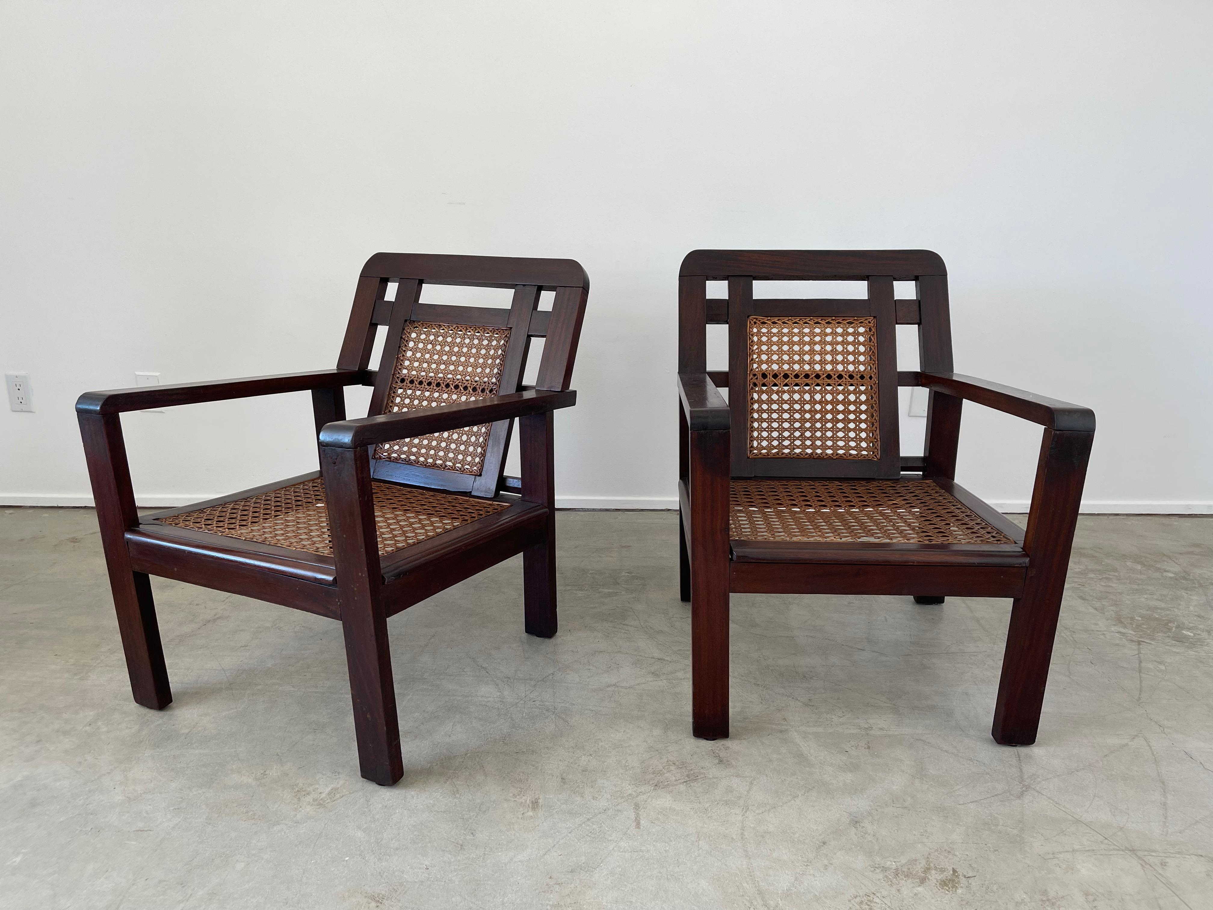 Pair of French caned chairs in geometric open shape with original open circle caning. 
Great angular back and dark grain to patina.
   