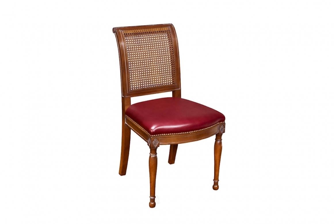 A stunning French caned Directoire dining chair, 20th Century.

The caned Directoire dining chair is shown in cherry wood with a caned back and Avignon finish. Caned Directoire dining chairs are much like contemporary armchairs save for the