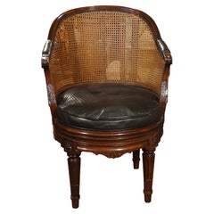 French Caned Louis XVI Style Carved Walnut Swivel Desk Chair with Leather Seat