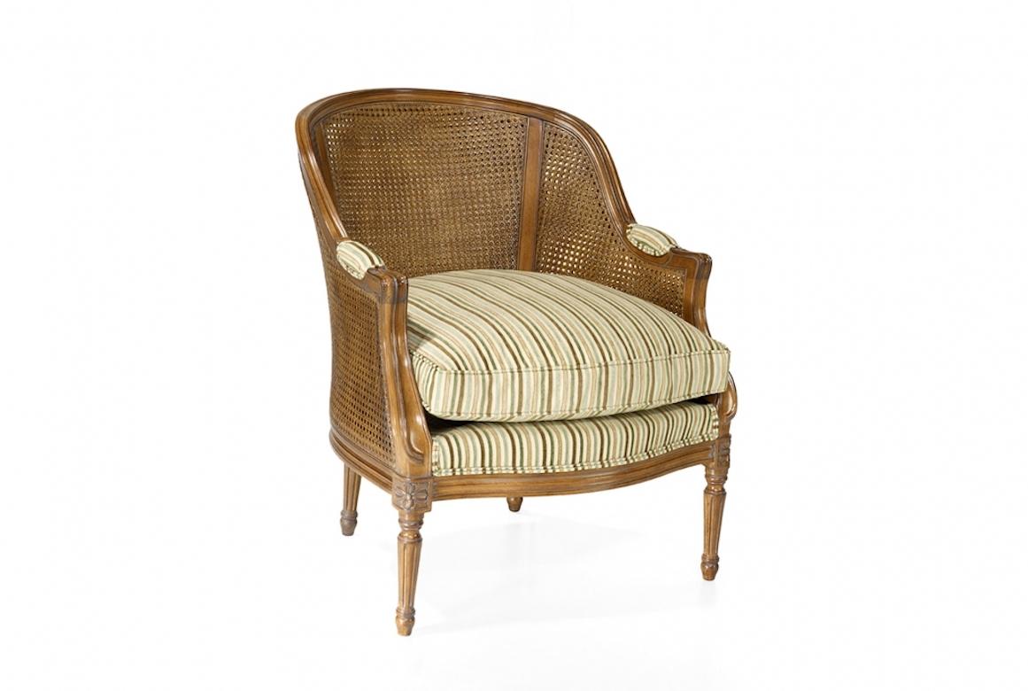 A stunning French Caned Vallencourt armchair, 20th century.

The Caned Vallencourt armchair is shown in cherrywood with an Avignon finish. A Classic caned Louis XVI-style armchair, the Vallencourt has a coved en cabriolet back and fluted en