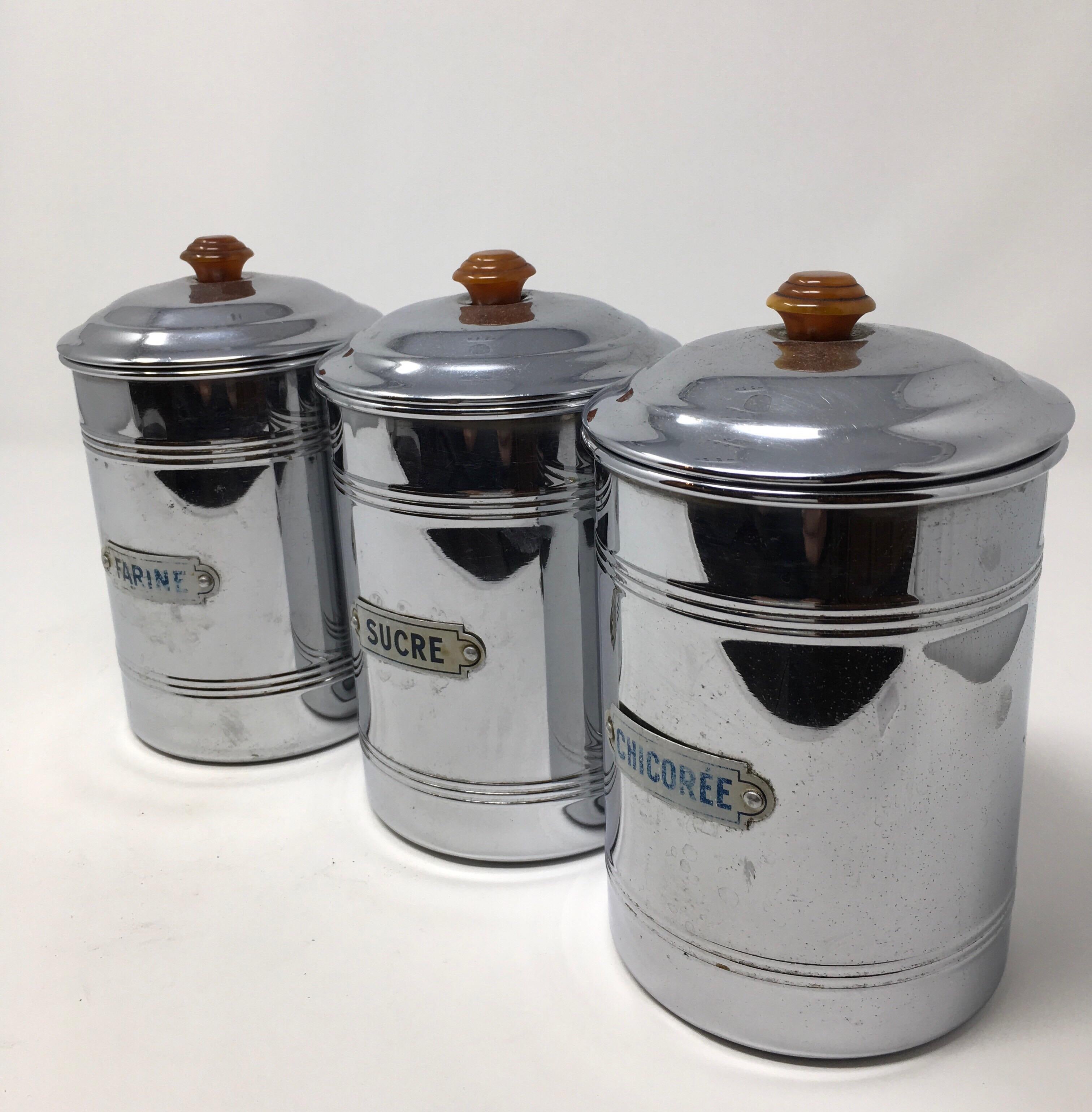 This French tin canister set consists of three equal size lidded canisters. The canisters are tin with plaques reading, Farine - flour, Sucre - sugar and Chicoree - chicory. This lovely set will surely add French charm to your kitchen.