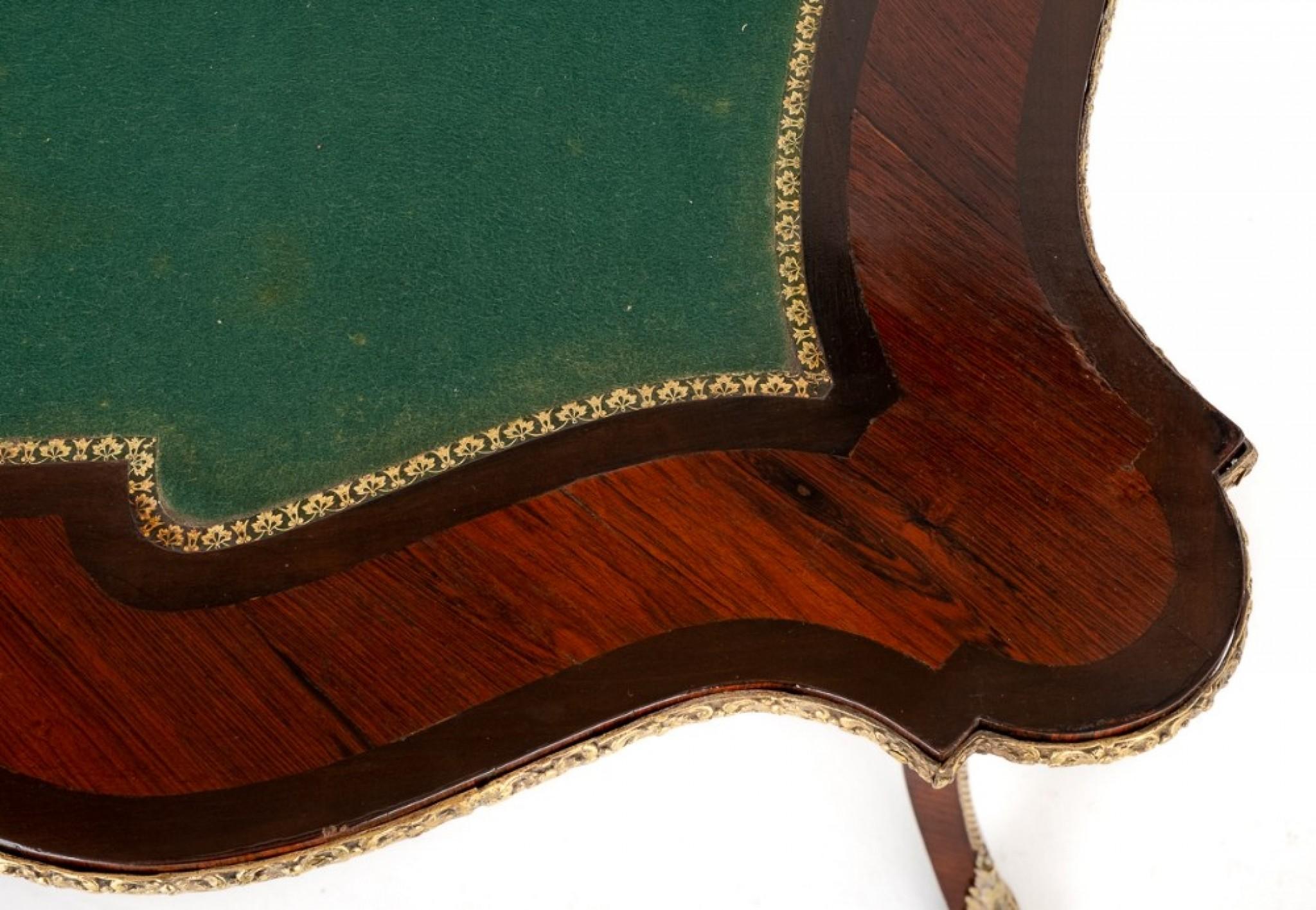Good quality mahogany and rosewood French card table.
This stunning French card table stands upon shaped legs with ormolu mounts to the feet and knees.
circa 1860.
The shaped frieze having cast ormolu mouldings.
The central plaque featuring a