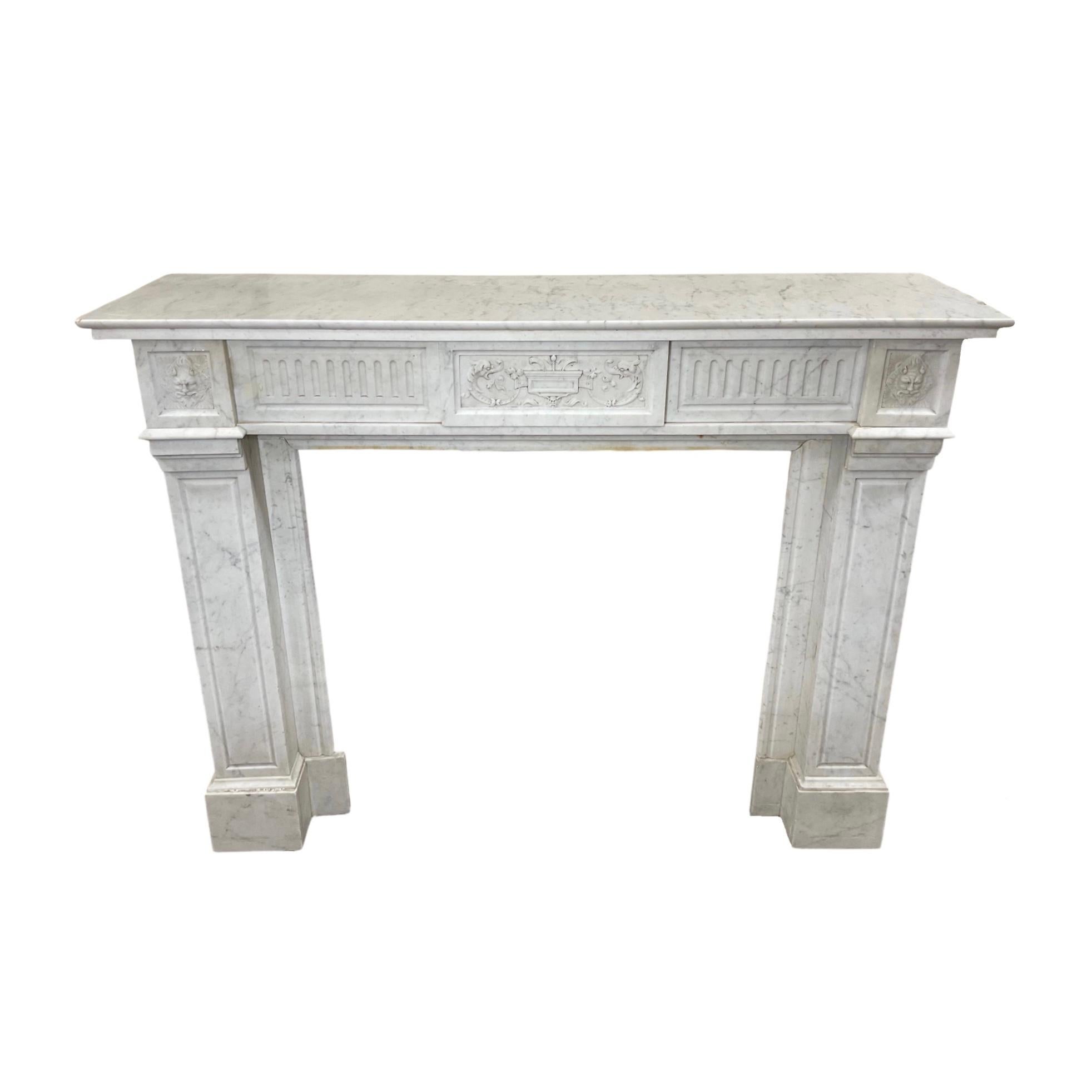 This exquisite 1880s French Carrara Marble Mantel is crafted from the finest white marble from France. The intricate Louis XVI-style carvings, exquisite craftsmanship, and timeless beauty make this mantel a unique and elegant piece for any home.