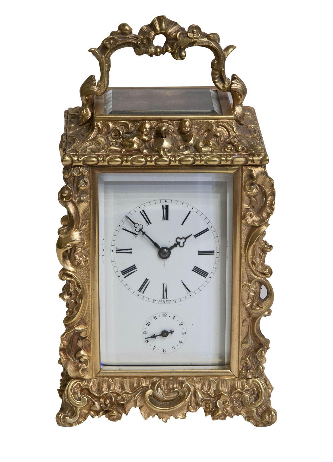 A late 19th century French striking, repeating carriage clock in an ornate brass case by H. Azur of Paris

circa 1890.