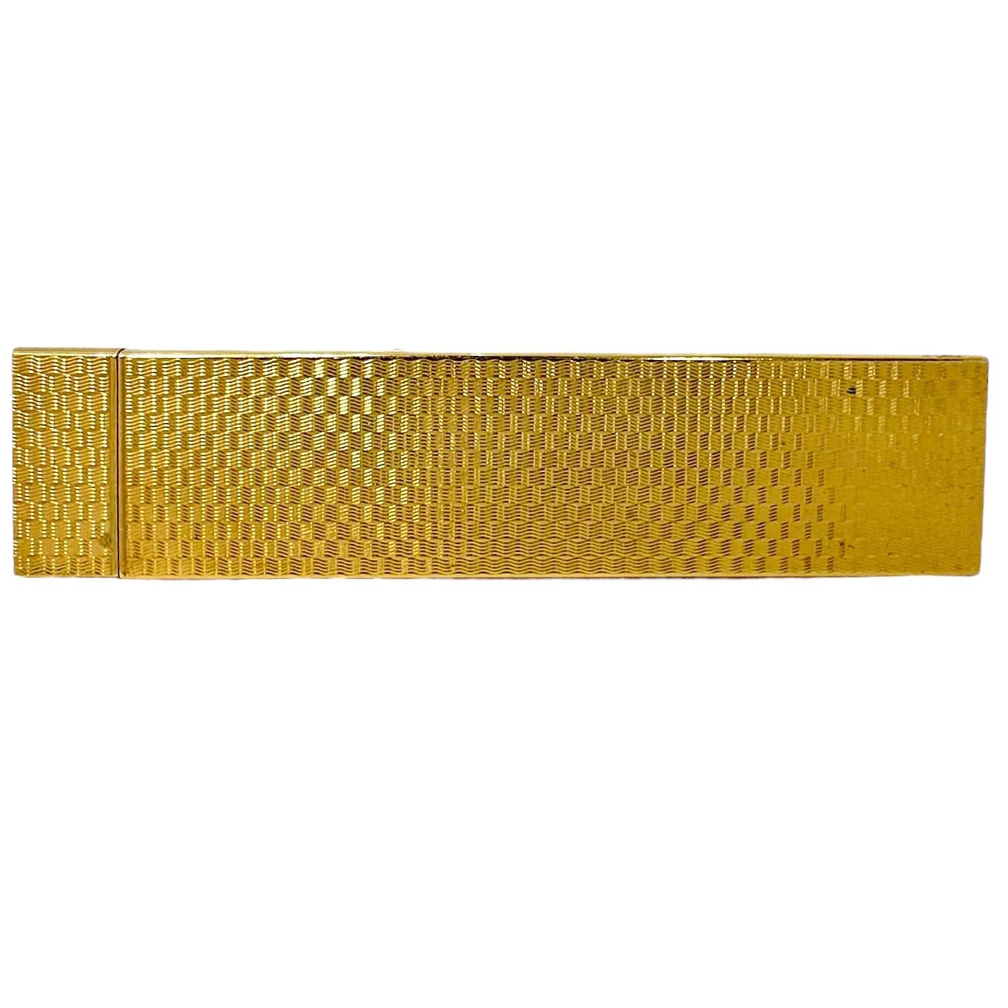 This French Cartier travel comb truly represents the epitome of personal grooming accessories from the early 20th Century. The 18k yellow gold case is finished in an undulating deeply engraved finish on both faces. All edges are high polish finish. 