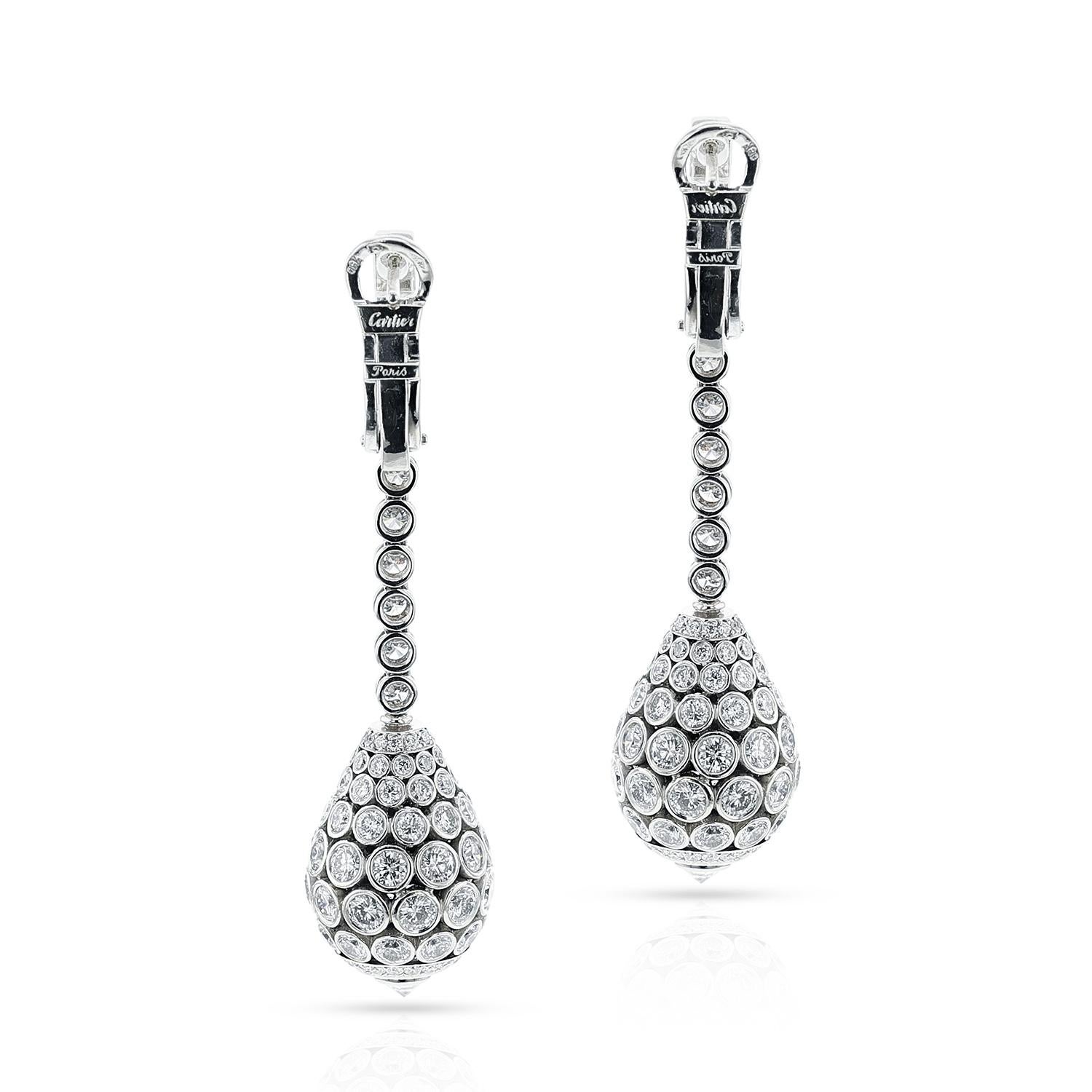 SKU 1153

A pair of French Cartier Diamond Dangling Drop Earrings made in 18 karat white gold. The total diamond weight is appx. 15 carats. The total length of the earring is 2.35 inches. The total weight of the earring is 22.06 grams. 