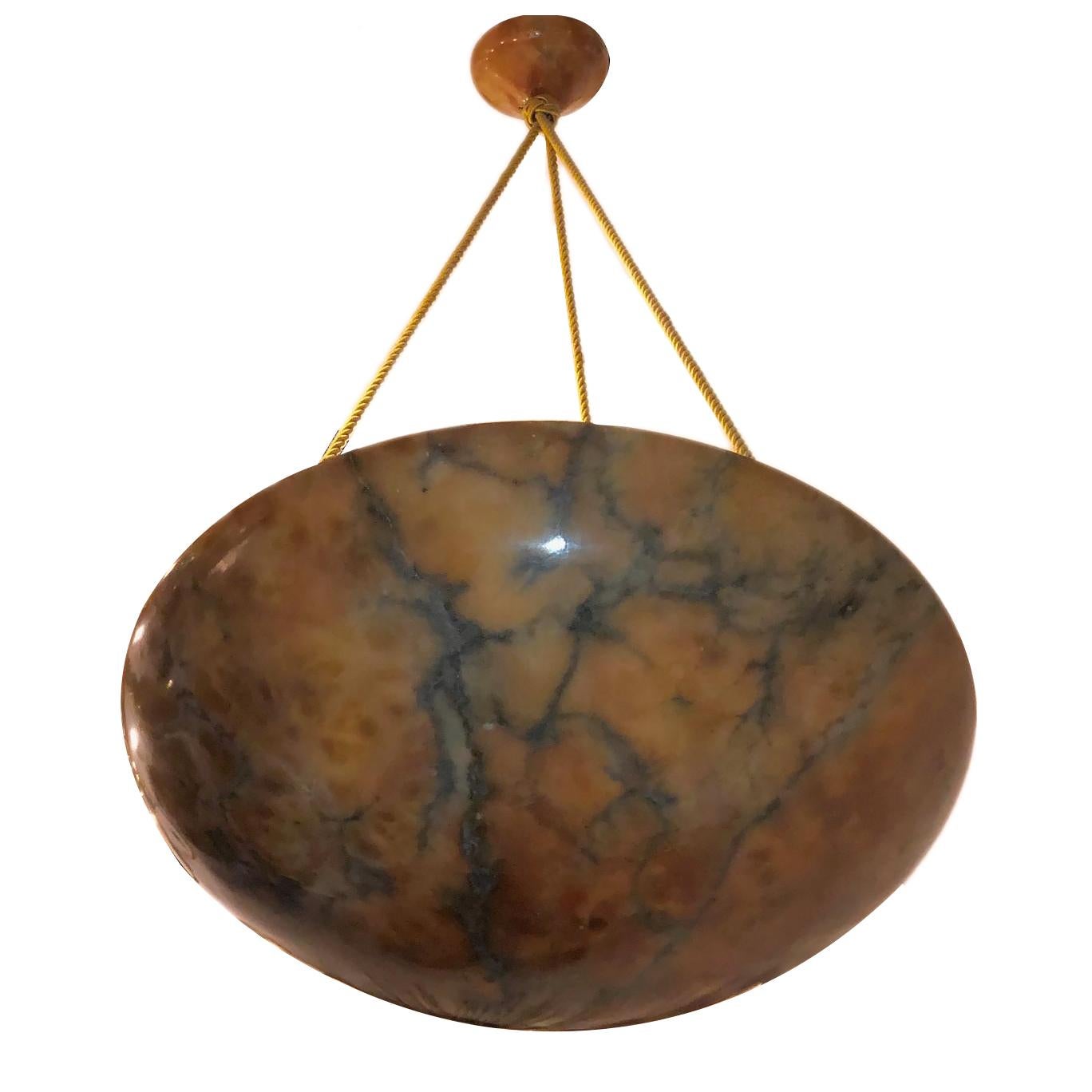 A French circa 1920s carved alabaster light fixture with interior lights.

Measurements:
Diameter 22.5