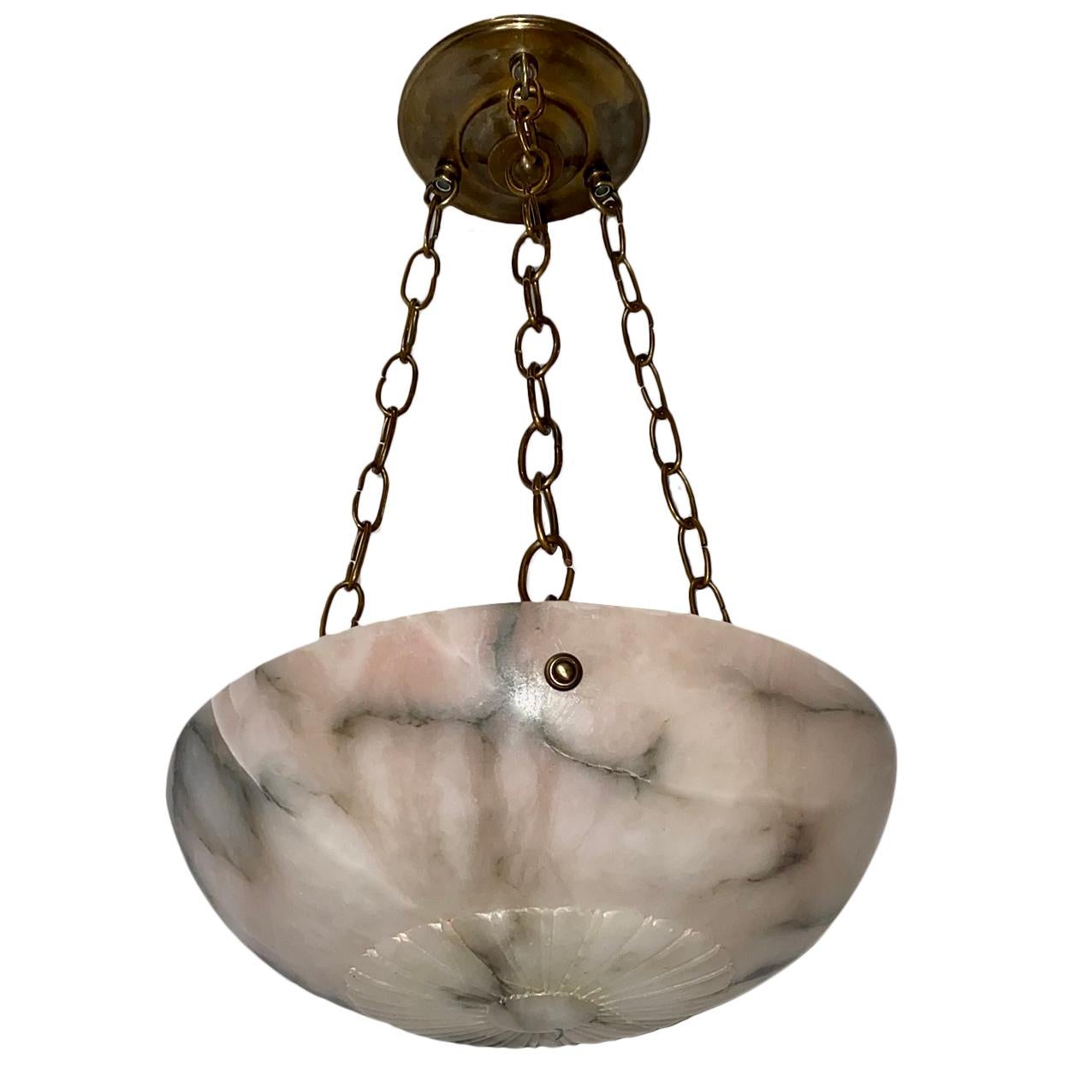 A circa 1920s French carved alabaster light fixture with three interior lights.

Measurements:
Diameter: 12