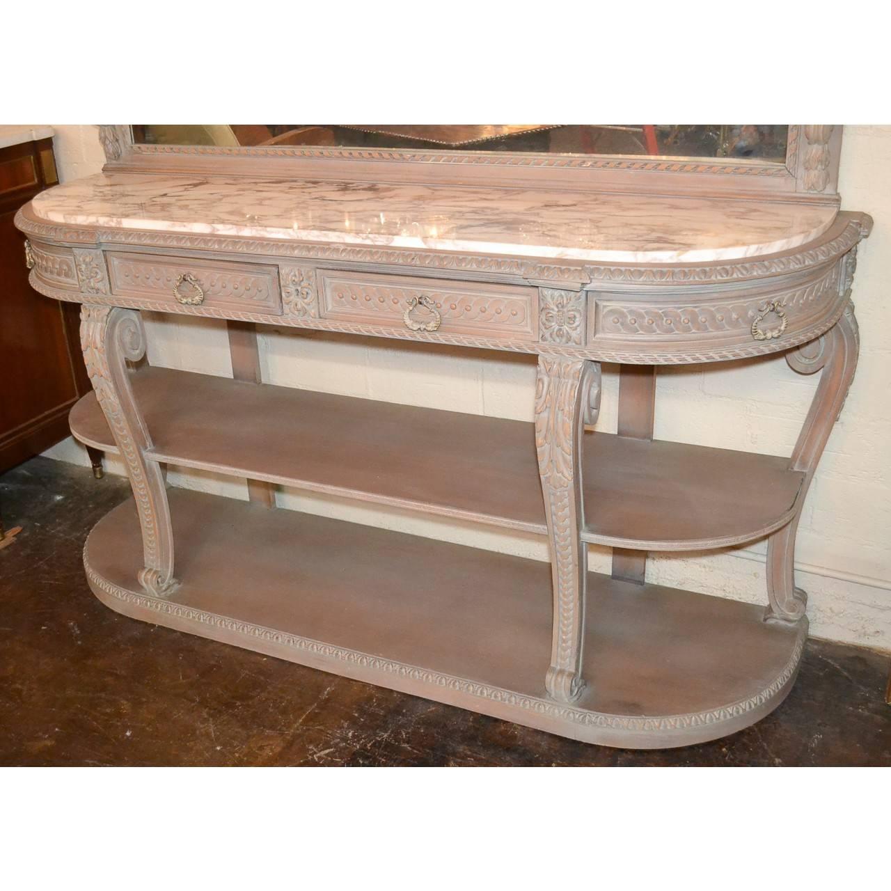 Superior quality French bleached and lacquered Jansen three tier server buffet with and exquisite marble-top. The mirrored upper portion finely carved with festoon and garland swags flanked by carved cornucopia. The four drawer frieze with rounded