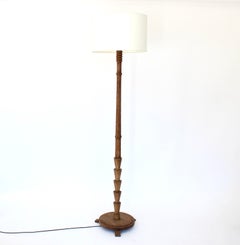 French Carved And Turned Raw Wire Brushed Oak Floor Lamp  France, circa 1940