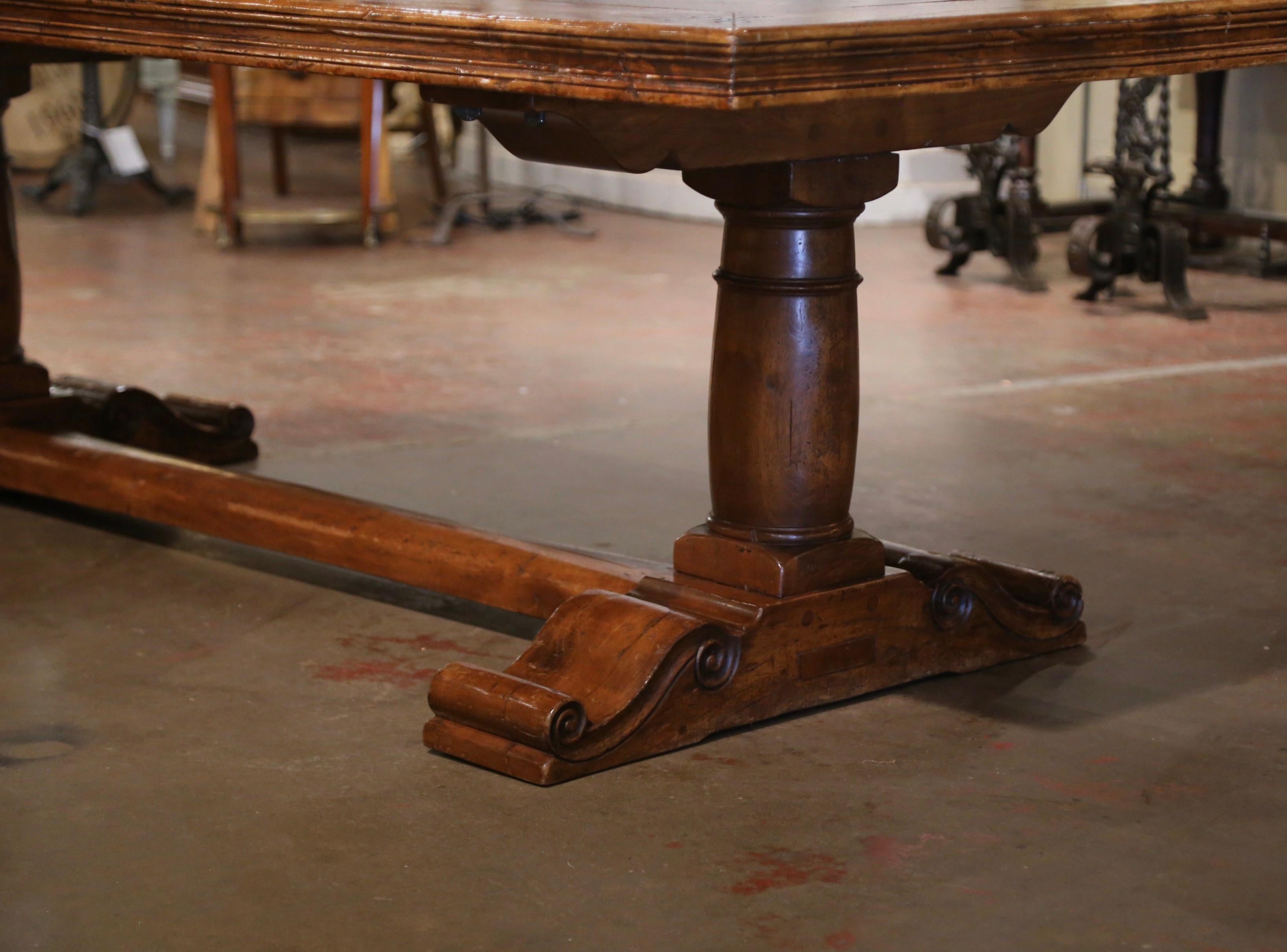 Late 20th Century  French Carved Antique Walnut & Elm Trestle Dining Table with Fleur de Lys Decor For Sale