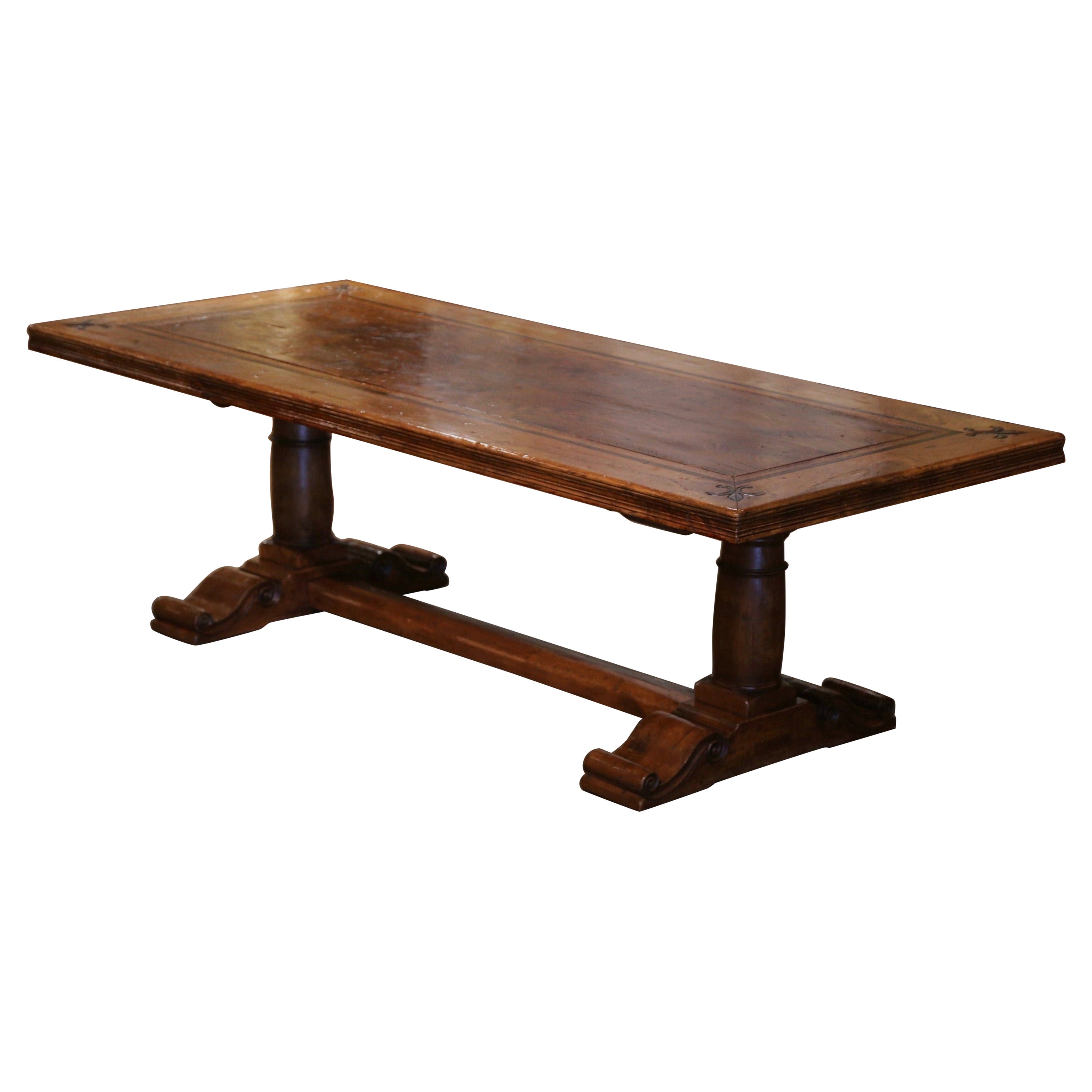 French Carved Antique Walnut 
Elm Trestle Dining Table with Fleur de Lys Decor
