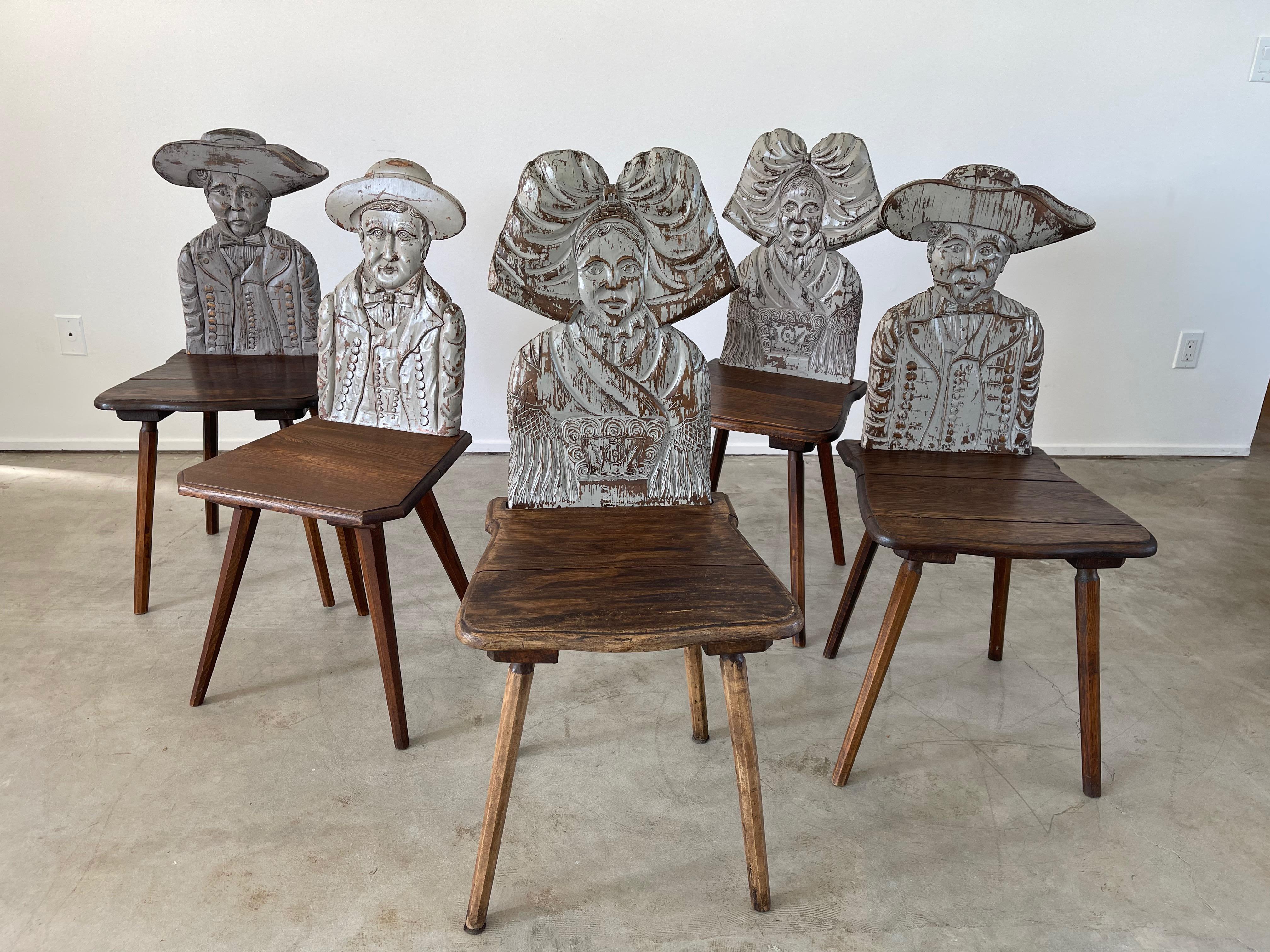 Unique intricately carved dining chairs with heads in different shapes
Wonderful patina and sold individually.

Great as a corner chair!
   