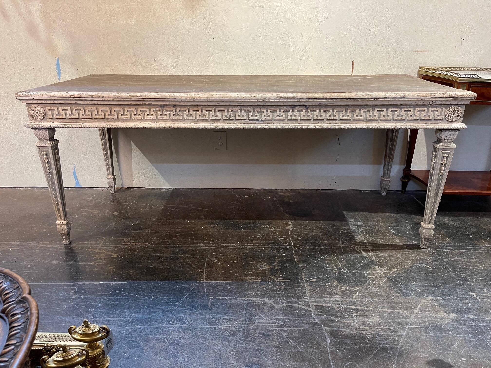 Very fine French carved dining tables with a Greek key design. The top is painted in a chalky grey. Creates a unique look! Note: There are 2 available. Price listed is for 1