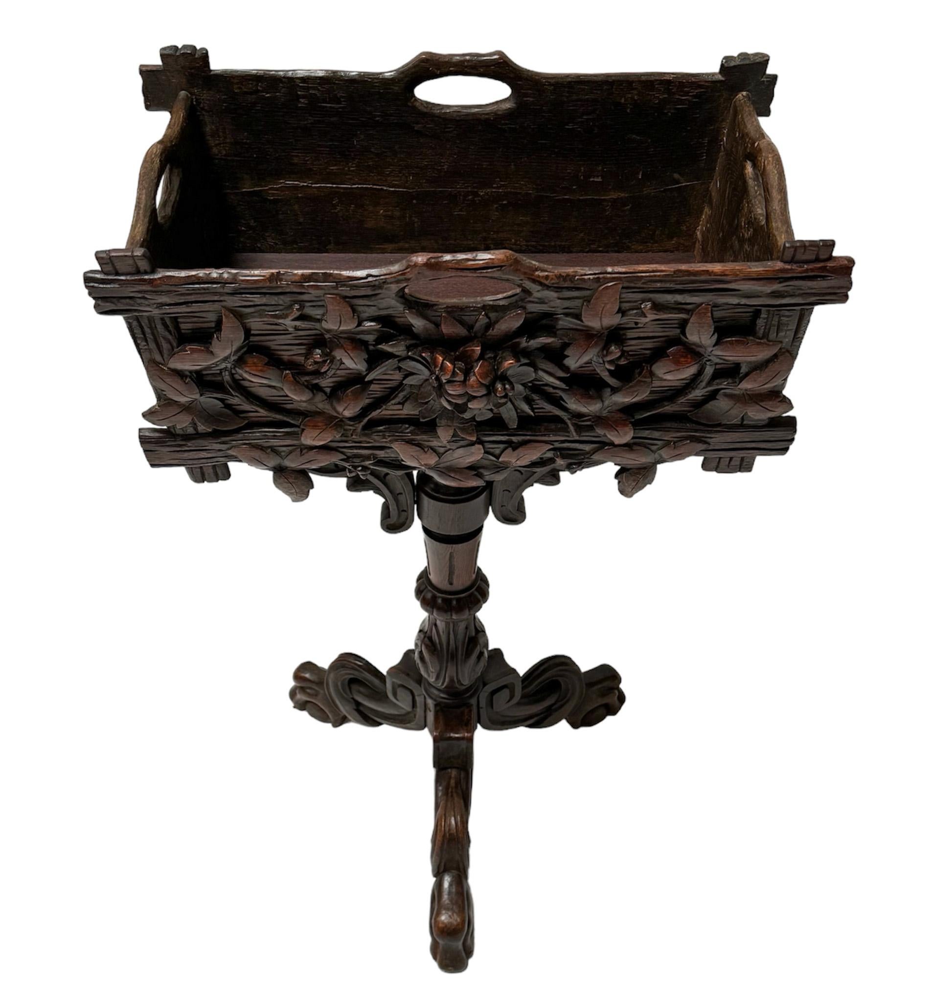 Magnificent and rare Black Forest planter or jardiniiere.
Striking French design from the 1880s.
Original hand-carved fruitwood base on a ornate turned and hand-carved baluster with stability from the three outstretched hand-carved paw feet.
Very