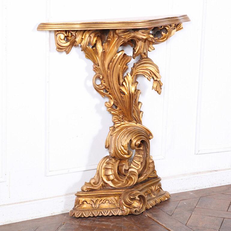 Mid 20th century French Console with matching mirror. Hand carved with a gilt finish. This piece is perfect for a foyer or hall.
Dimensions: 
Mirror - 27 inches wide by 43 inches tall, Console – 30 inches wide by 6 inches deep by 32 inches tall.