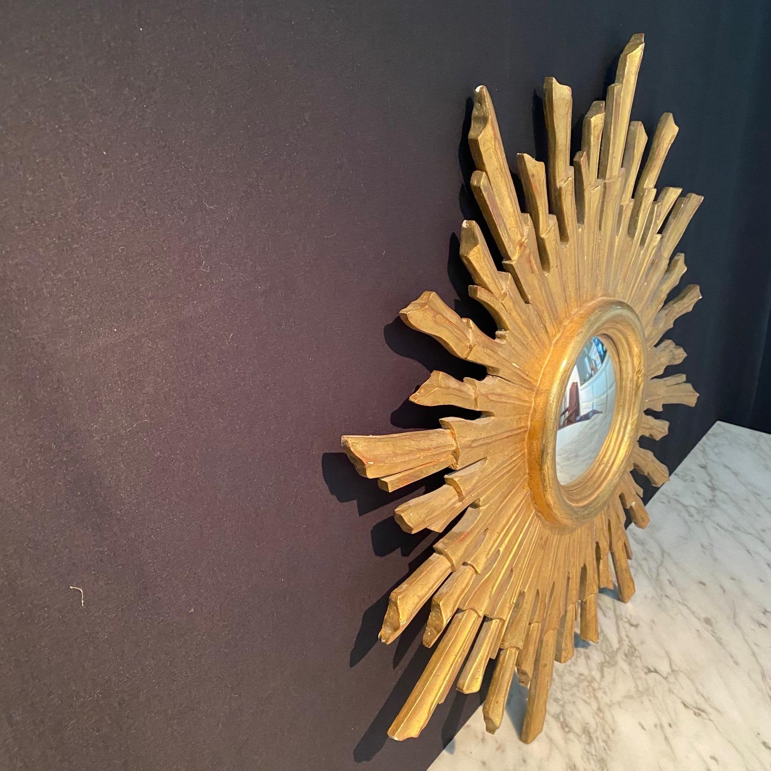 A very beautiful and decorative large golden soleil sunburst starburst giltwood convex mirror. Made and bought in France. Handmade of carved stunningly gilt-gold plated wood, in great condition. One of the best we have seen.
mirror itself is 5.75