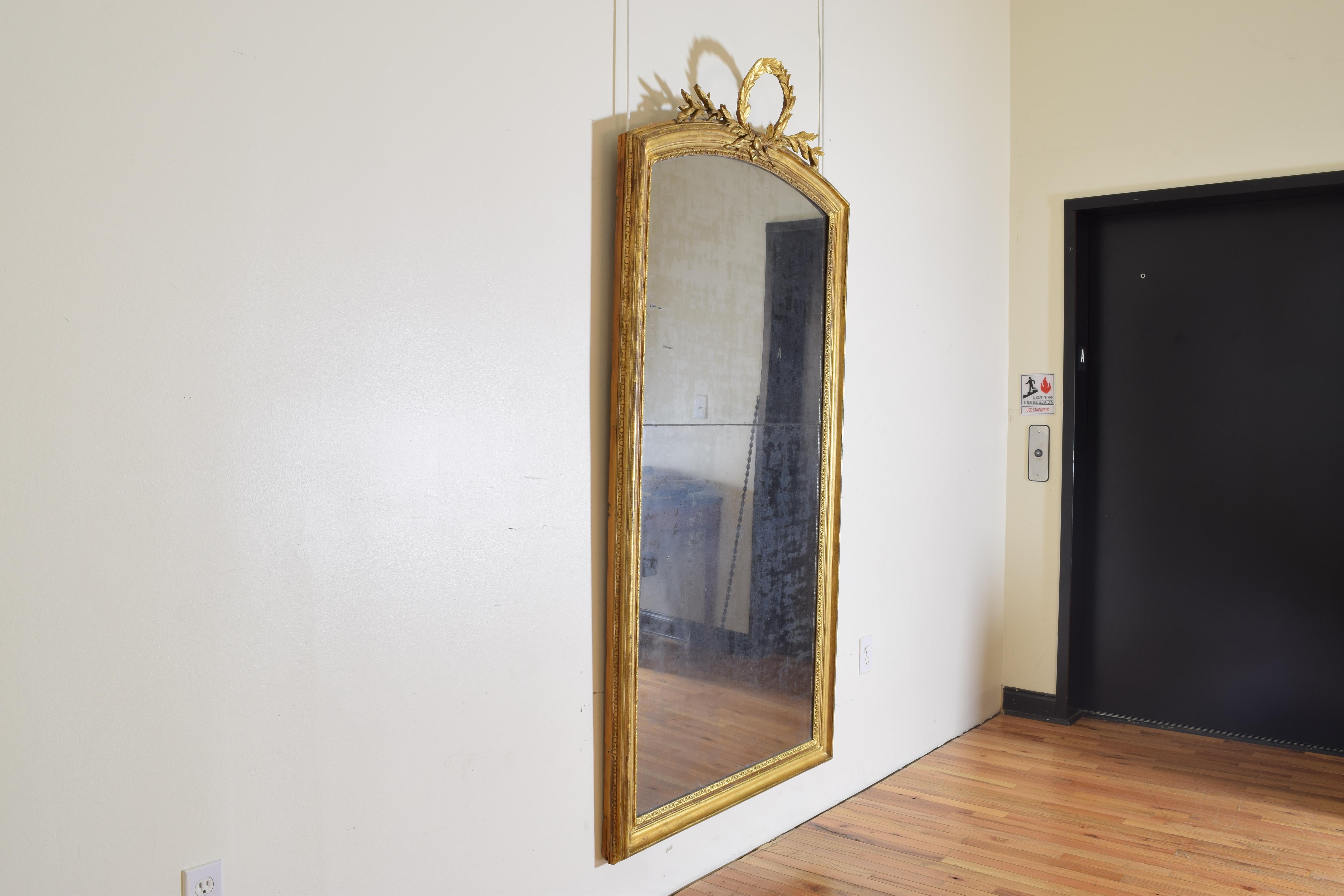 Mirror with carved laurel wreath finial, two-piece glass.