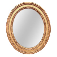 French Carved Giltwood Oval Wall Mirror, circa 1910